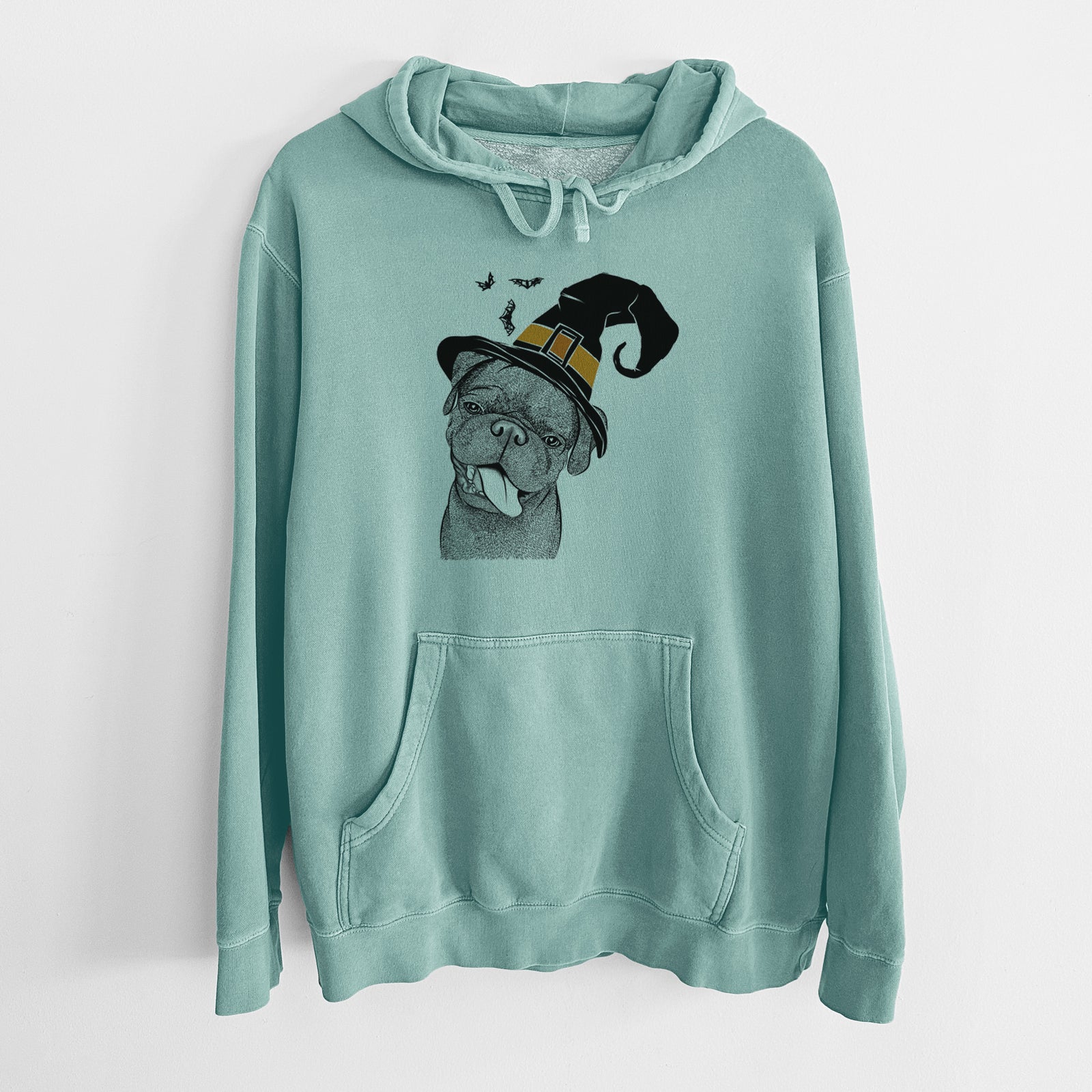 Hand-drawn sketch of Dudley Danger the Pug wearing a witch hat on a Mint Unisex pigment dyed hoodie