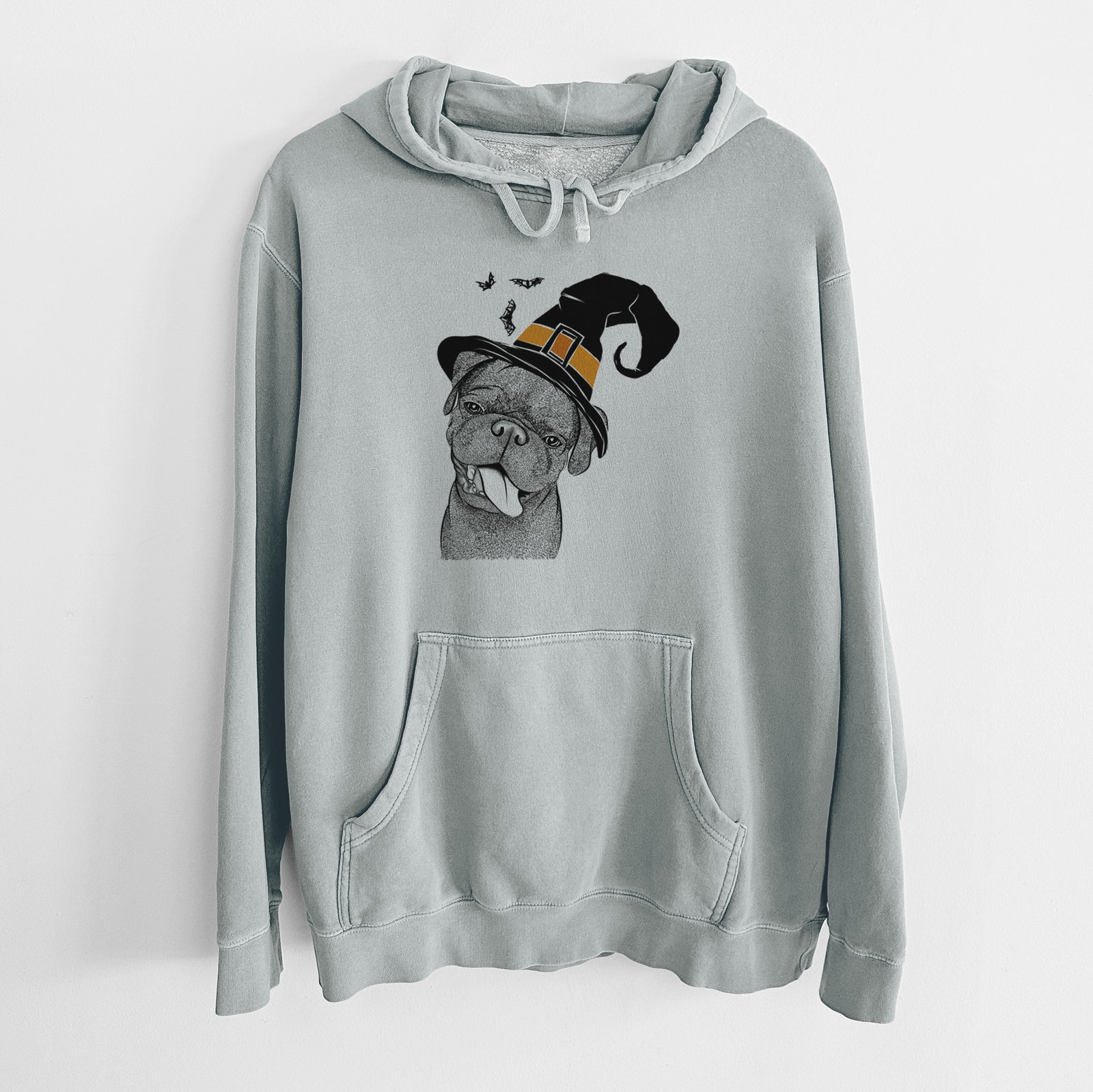 Hand-drawn sketch of Dudley Danger the Pug wearing a witch hat on a Sage Unisex pigment dyed hoodie