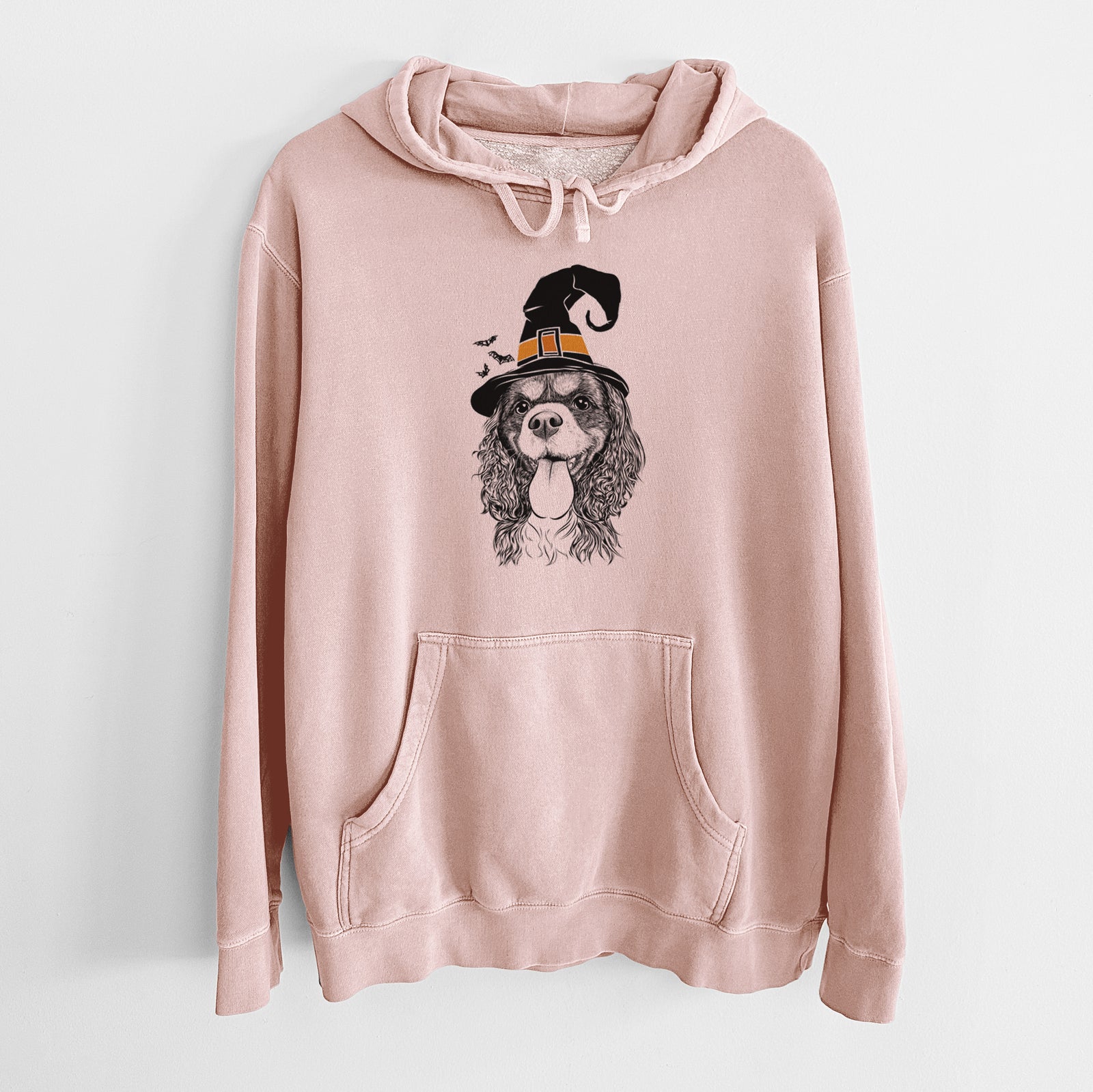 Hand-drawn sketch of Elizabeth the Cavalier King Charles Spaniel wearing a witch hat on a Dusty Pink Unisex pigment dyed hoodie