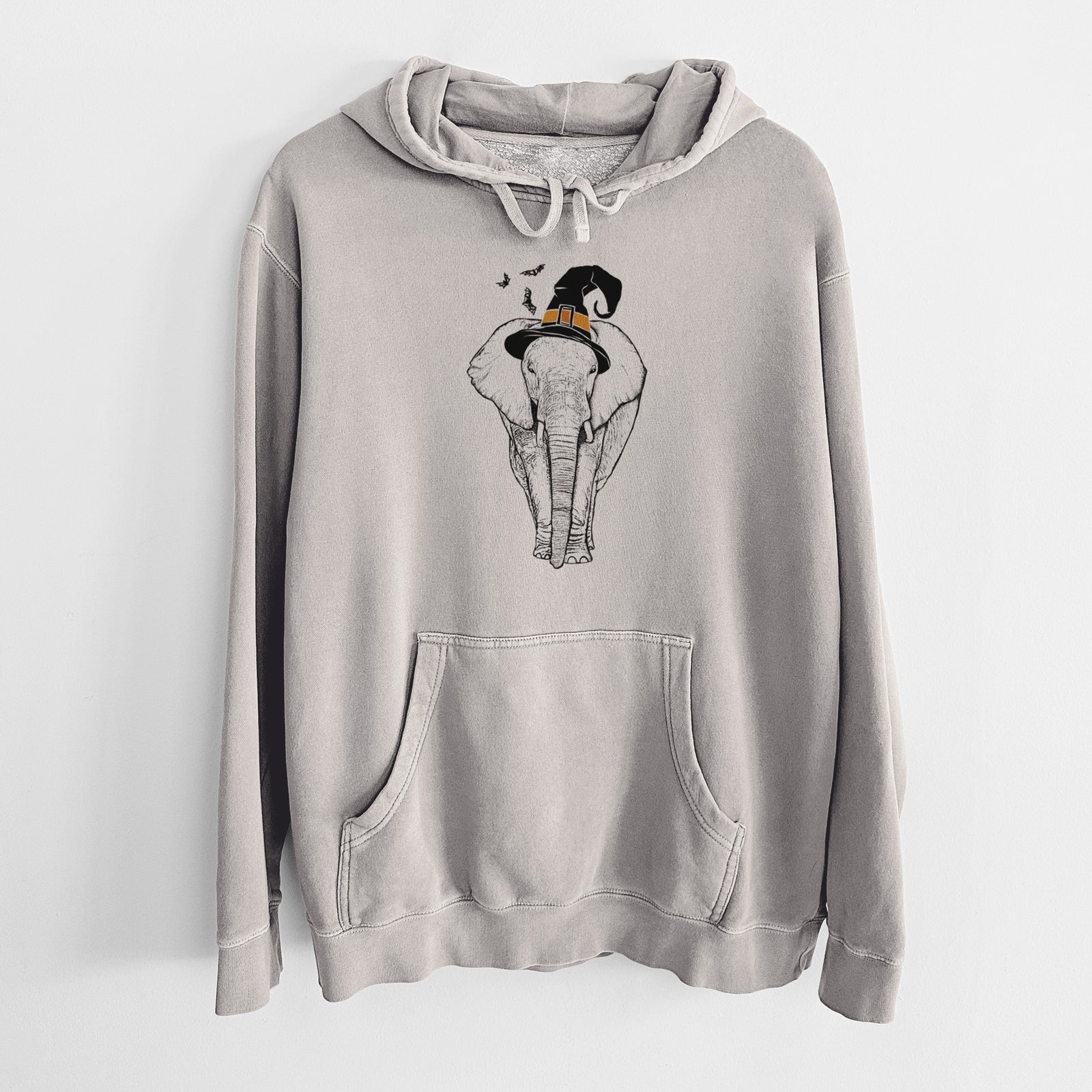Hand-drawn sketch of Ella the Elephant wearing a witch hat on a Cement Unisex pigment dyed hoodie