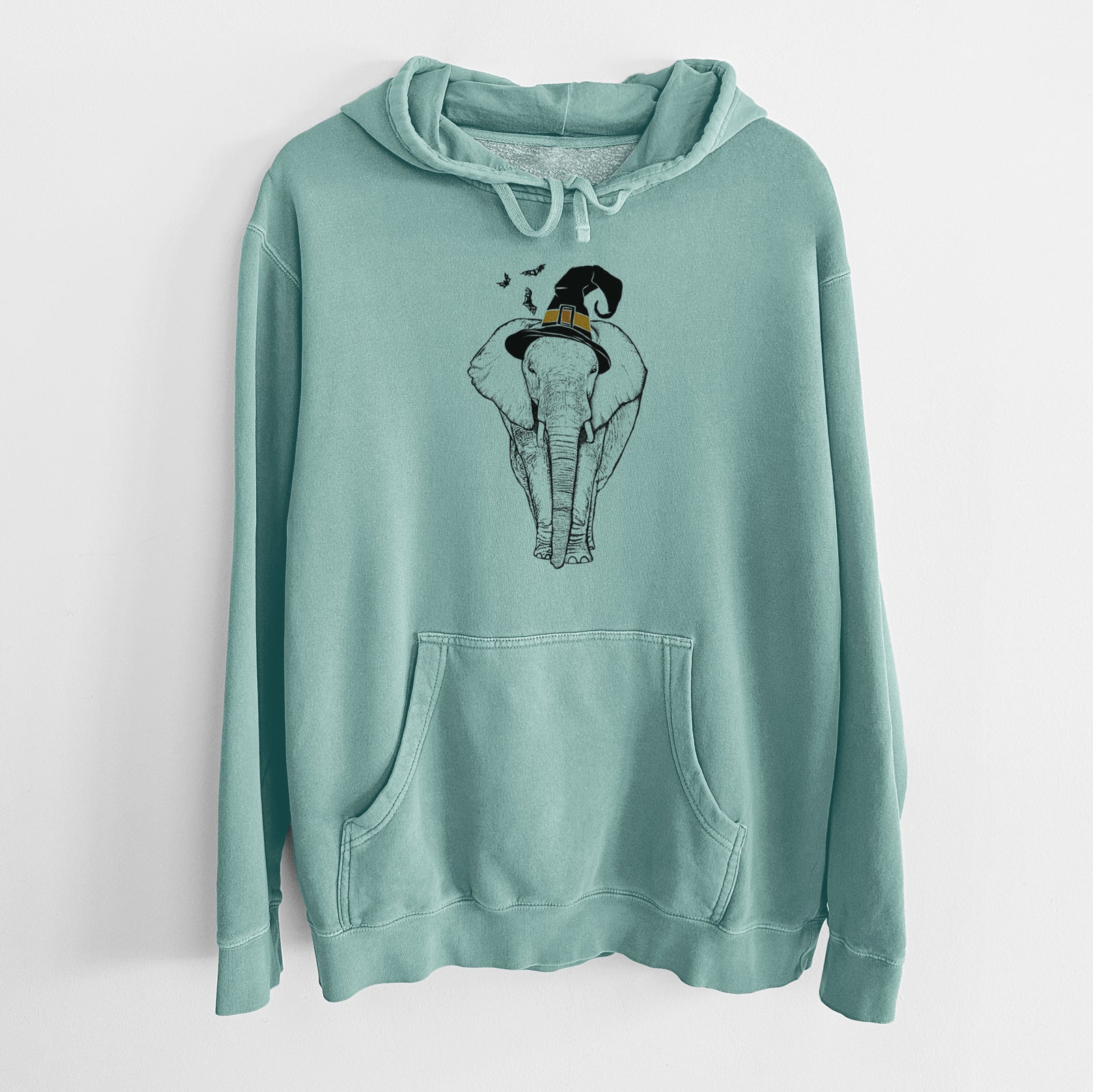 Hand-drawn sketch of Ella the Elephant wearing a witch hat on a Mint Unisex pigment dyed hoodie