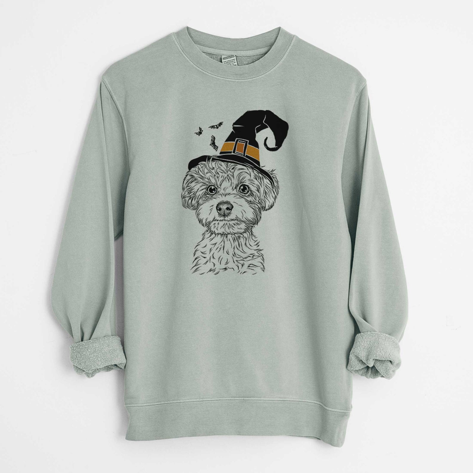 Hand-drawn sketch of Elliott the Yorkiepoo wearing a witch hat on a Sage Unisex pigment dyed crew sweatshirt