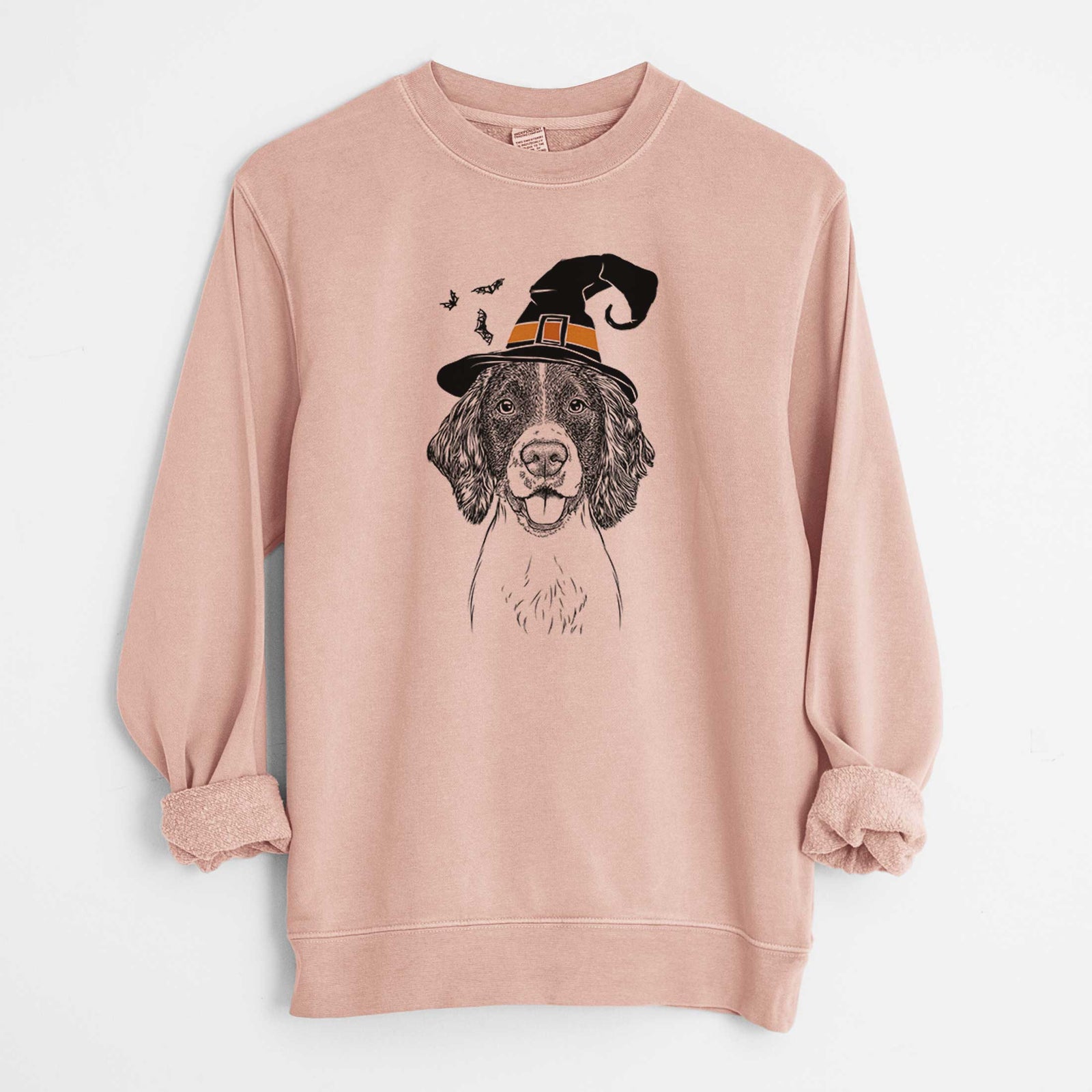 Hand-drawn sketch of Ever the English Springer Spaniel wearing a witch hat on a Dusty Pink Unisex pigment dyed crew sweatshirt