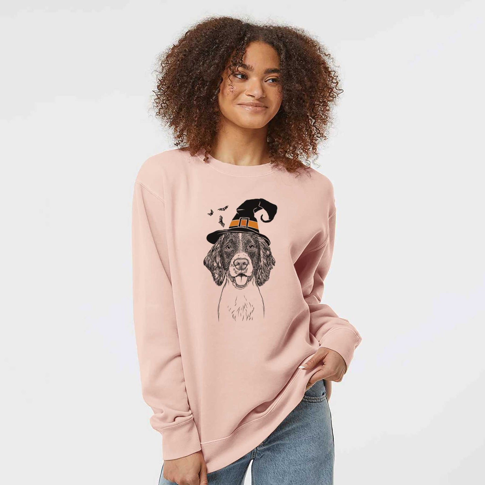 Hand-drawn sketch of Ever the English Springer Spaniel wearing a witch hat on a Dusty Pink Unisex pigment dyed crew sweatshirt