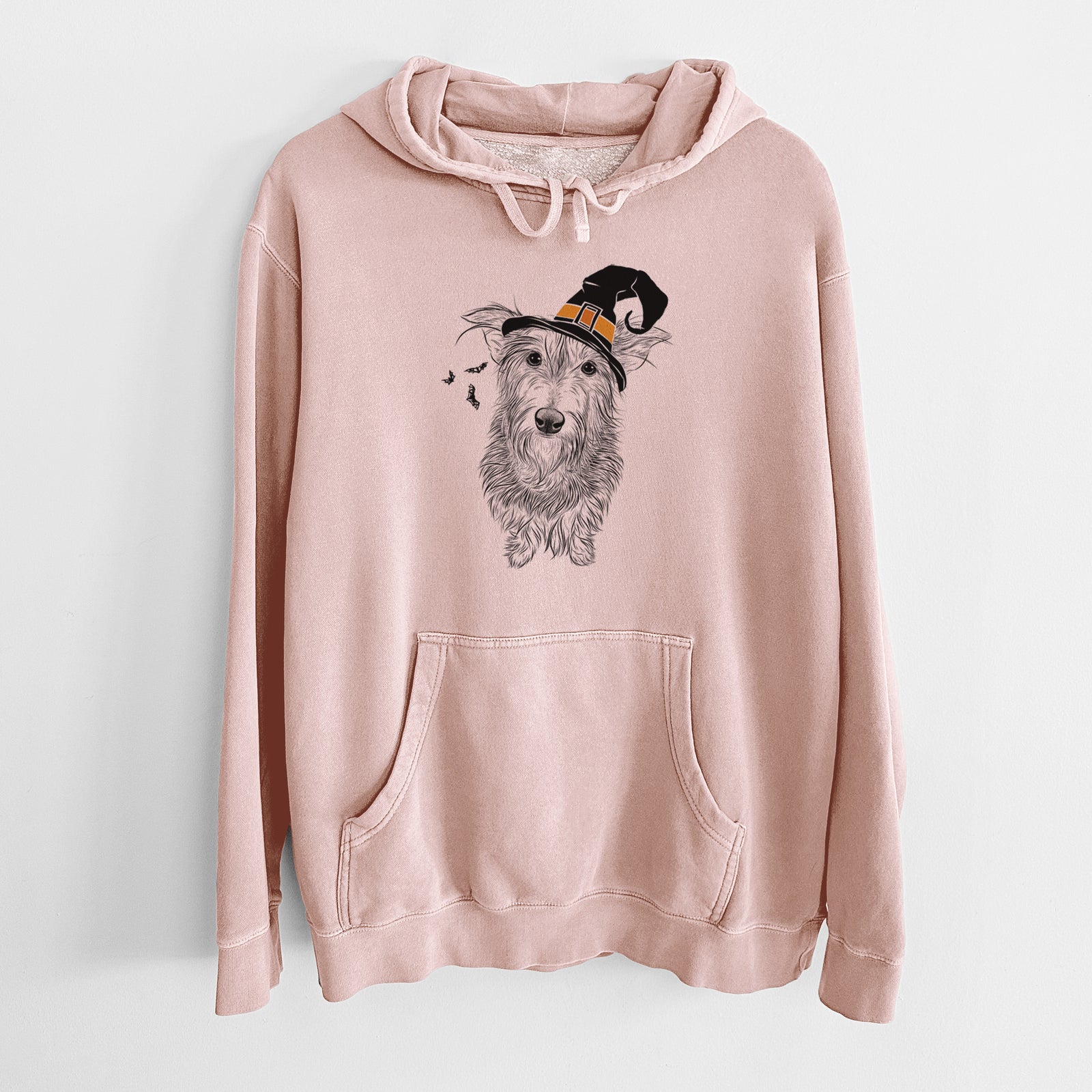 Hand-drawn sketch of Frida Doggo the Rescue Terrier Mix wearing a witch hat on a Dusty Pink Unisex pigment dyed hoodie