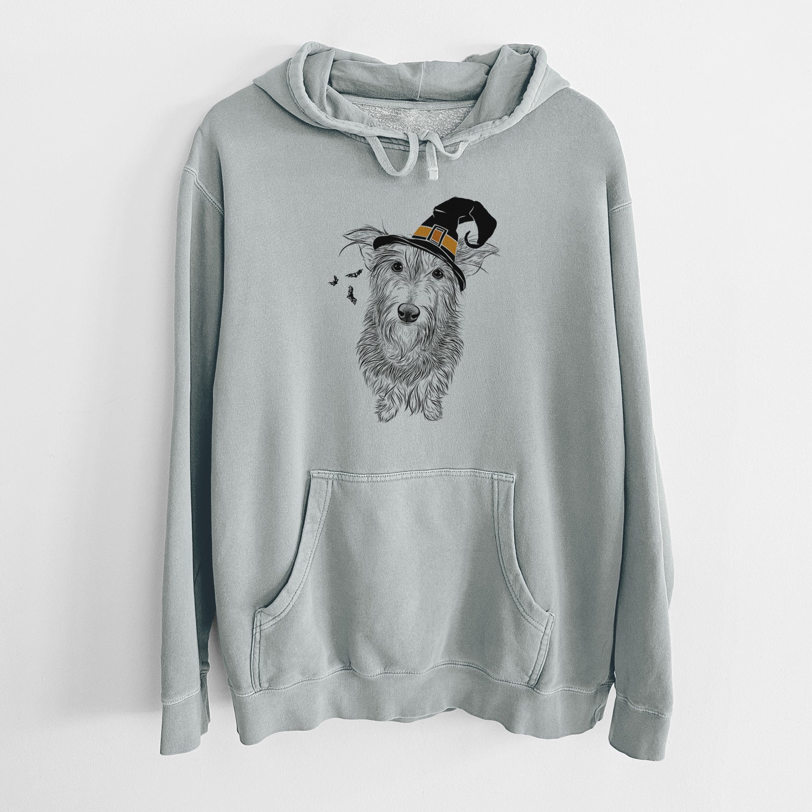 Hand-drawn sketch of Frida Doggo the Rescue Terrier Mix wearing a witch hat on a Sage Unisex pigment dyed hoodie