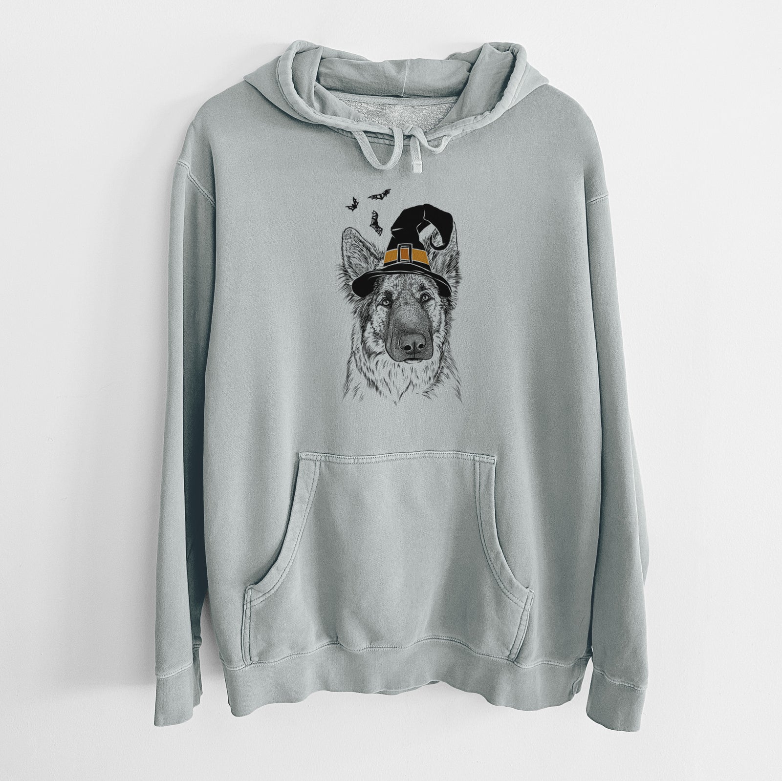 Hand-drawn sketch of Geddy the Shiloh Shepherd wearing a witch hat on a Sage Unisex pigment dyed hoodie