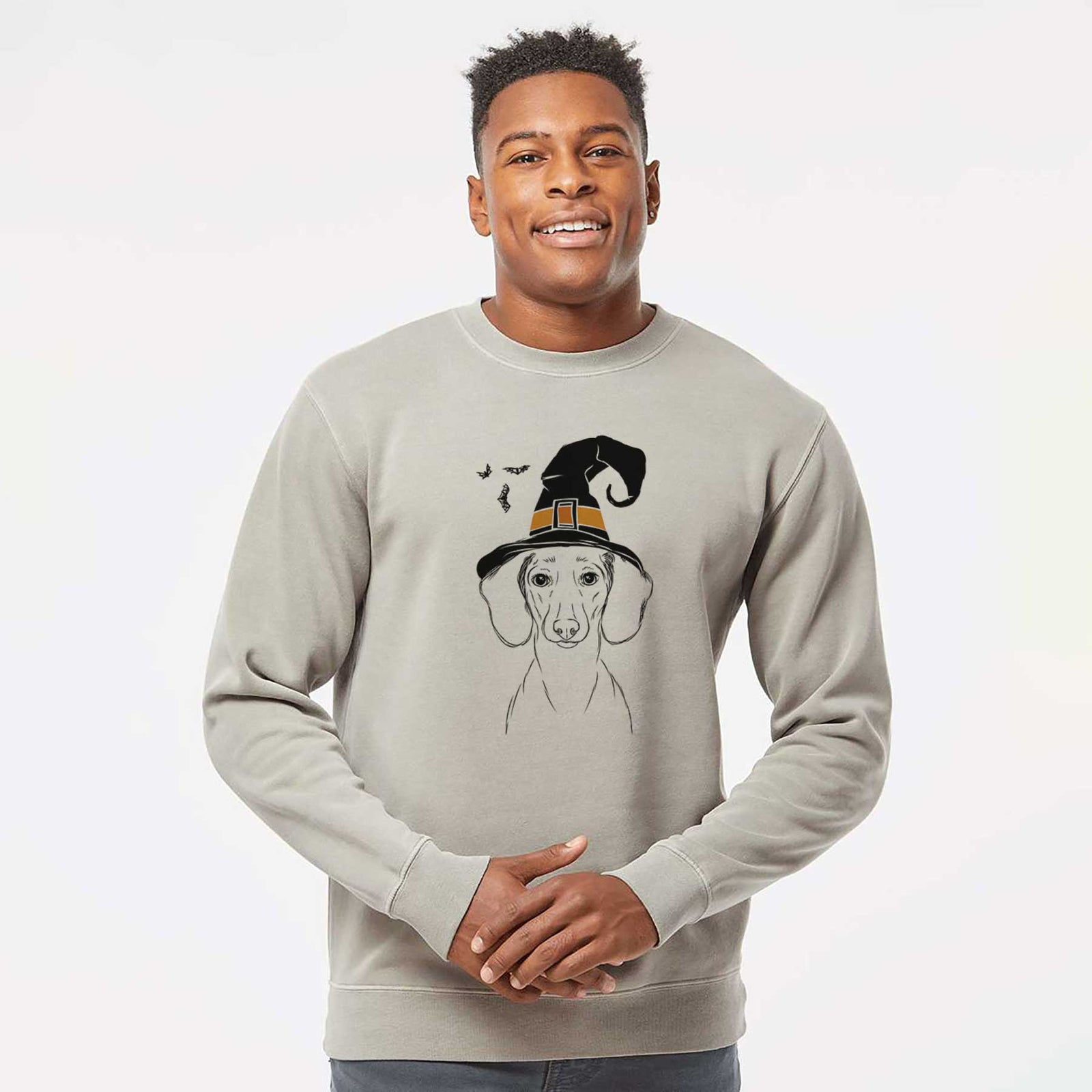 Hand-drawn sketch of Hans the Dachshund wearing a witch hat on a Cement Unisex pigment dyed crew sweatshirt