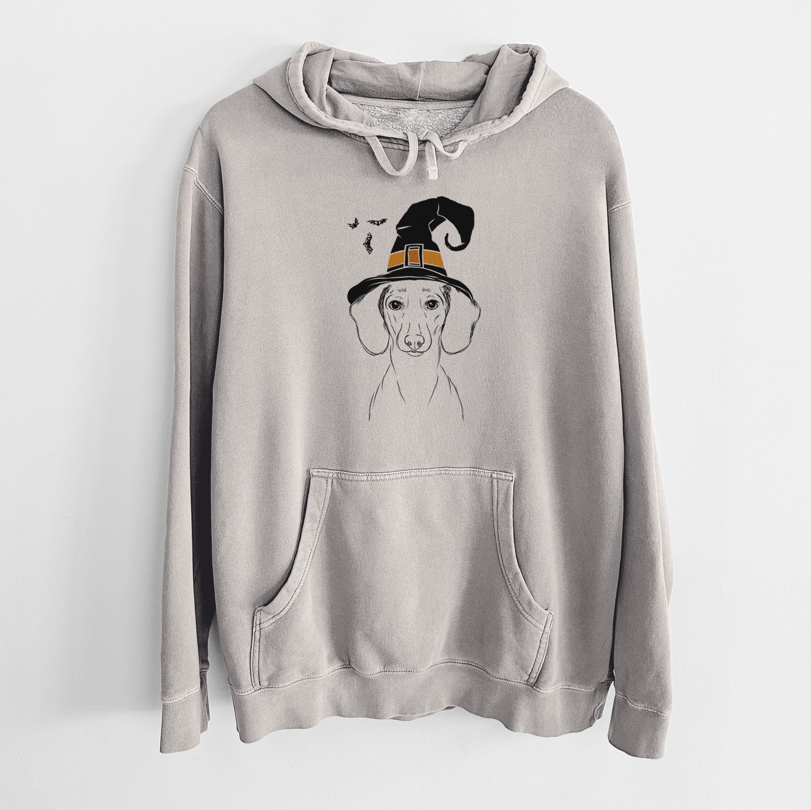 Hand-drawn sketch of Hans the Dachshund wearing a witch hat on a Cement Unisex pigment dyed hoodie