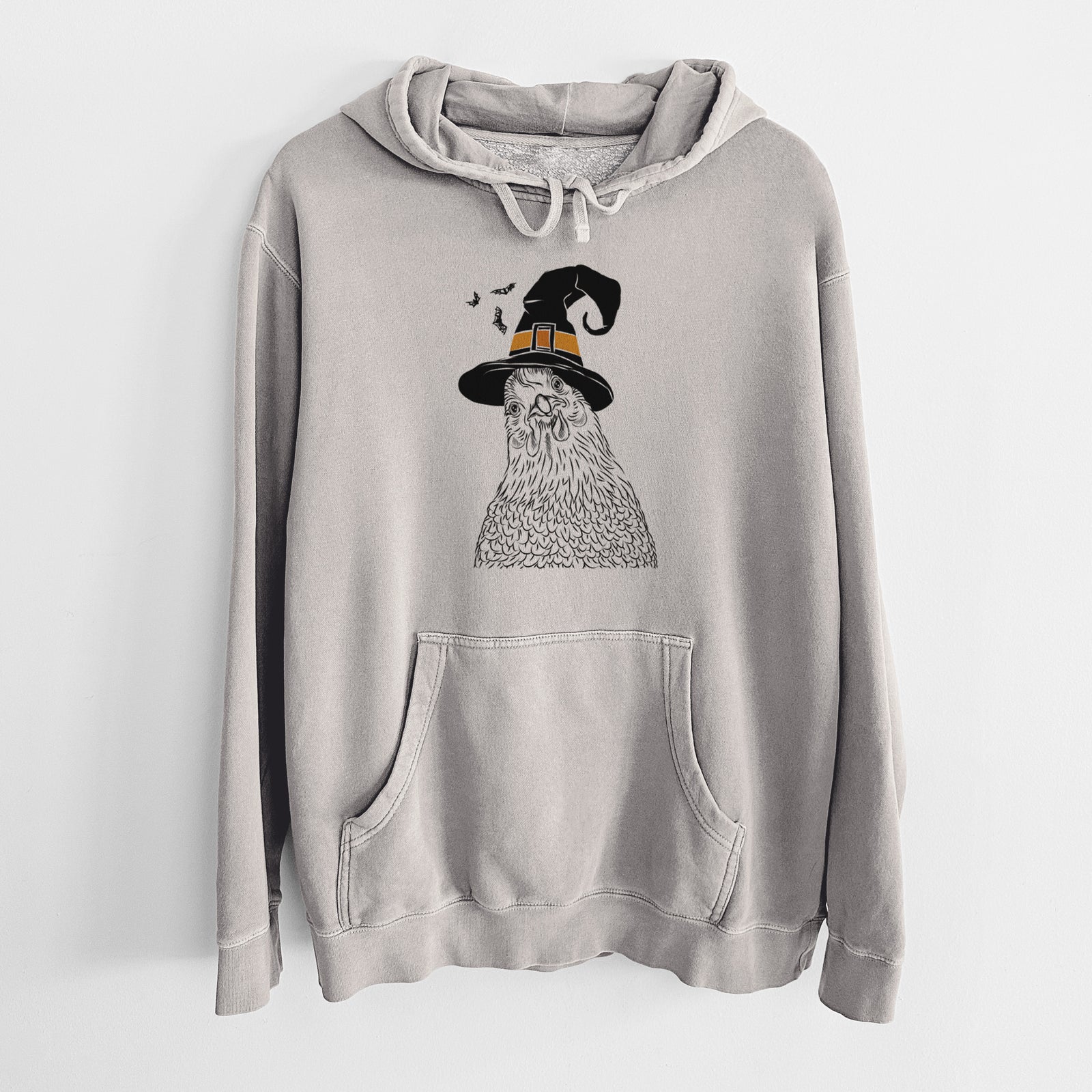 Hand-drawn sketch of Henrietta the Chicken wearing a witch hat on a Cement Unisex pigment dyed hoodie