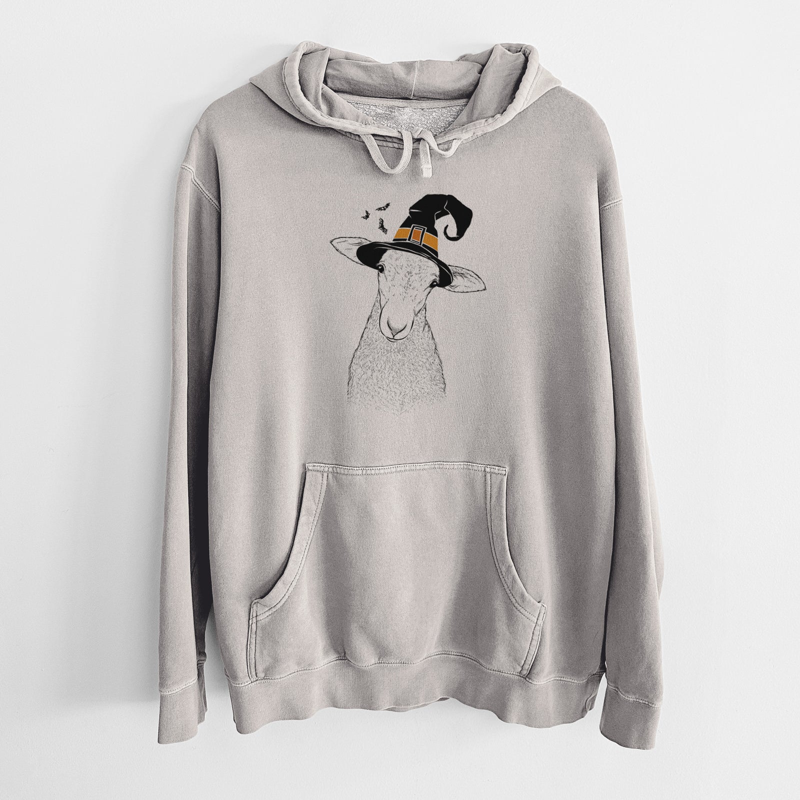 Hand-drawn sketch of Ivy the Lamb wearing a witch hat on a Cement Unisex pigment dyed hoodie