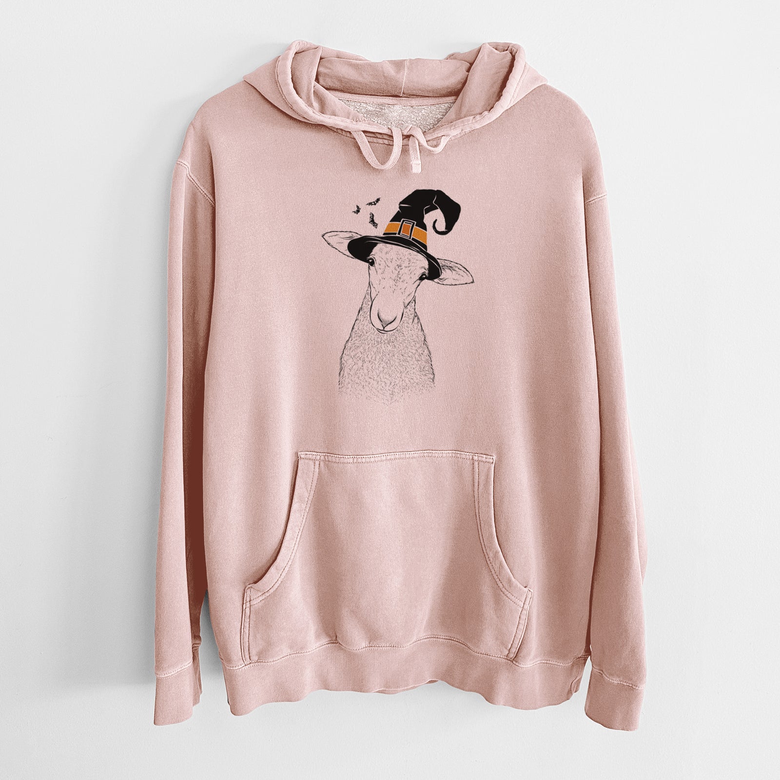 Hand-drawn sketch of Ivy the Lamb wearing a witch hat on a Dusty Pink Unisex pigment dyed hoodie