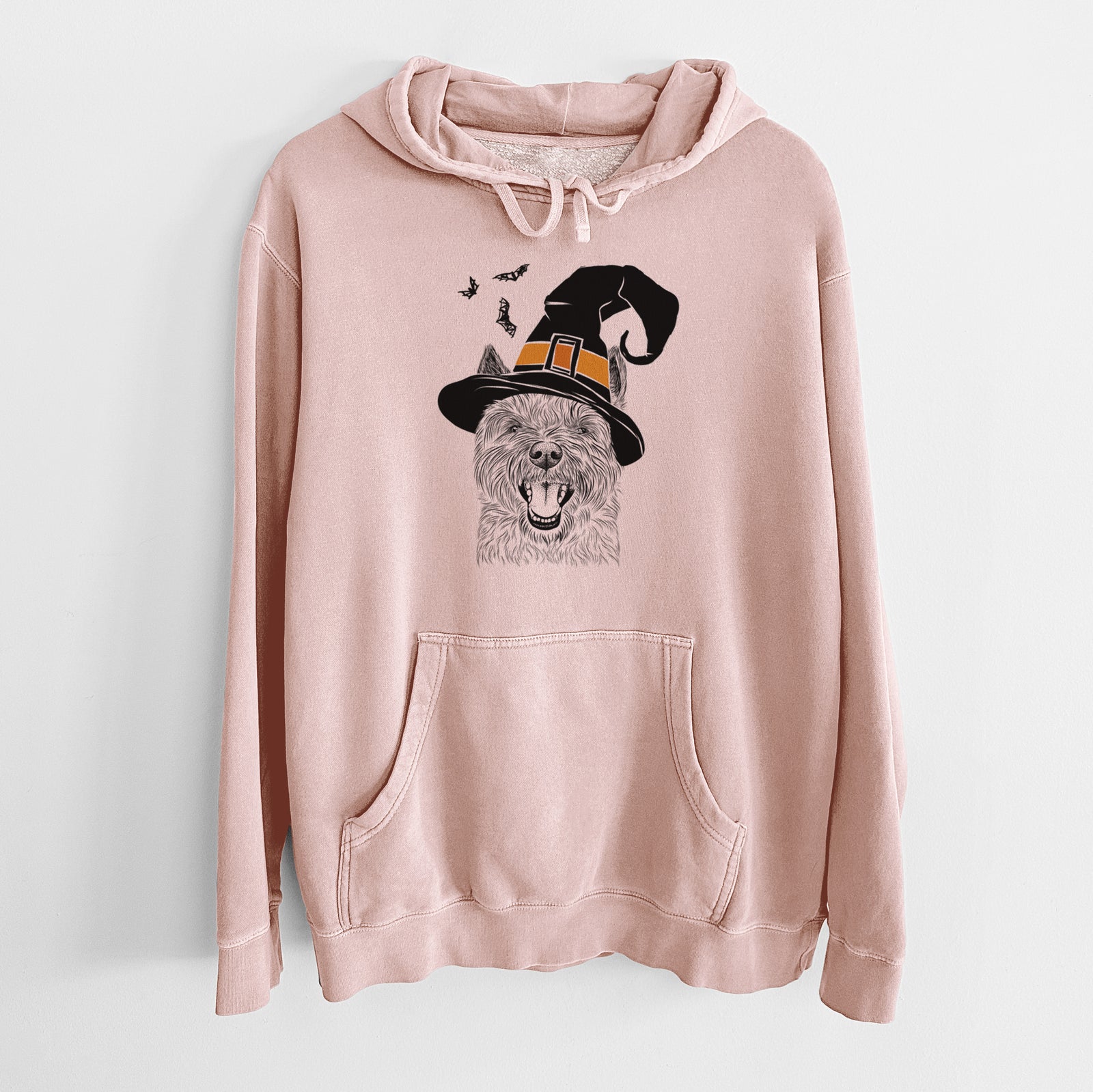 Hand-drawn sketch of Jeff the Cairn Terrier wearing a witch hat on a Dusty Pink Unisex pigment dyed hoodie