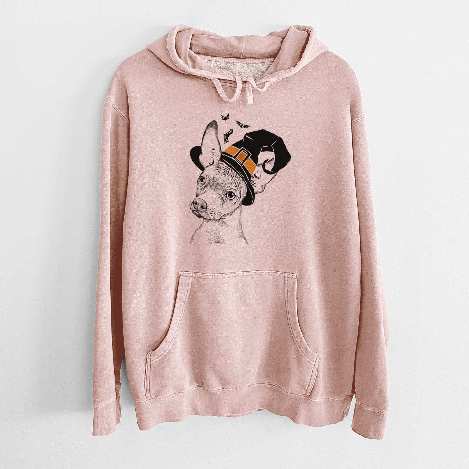 Hand-drawn sketch of Kahlo the Xoloitzcuintli wearing a witch hat on a Dusty Pink Unisex pigment dyed hoodie