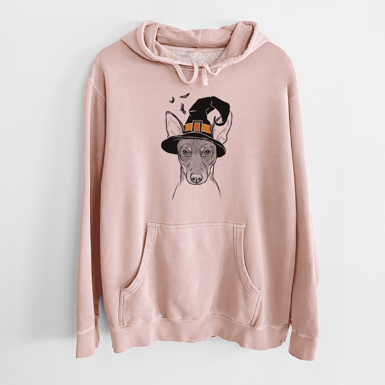 Hand-drawn sketch of Knox the Rat Terrier wearing a witch hat on a Dusty Pink Unisex pigment dyed hoodie