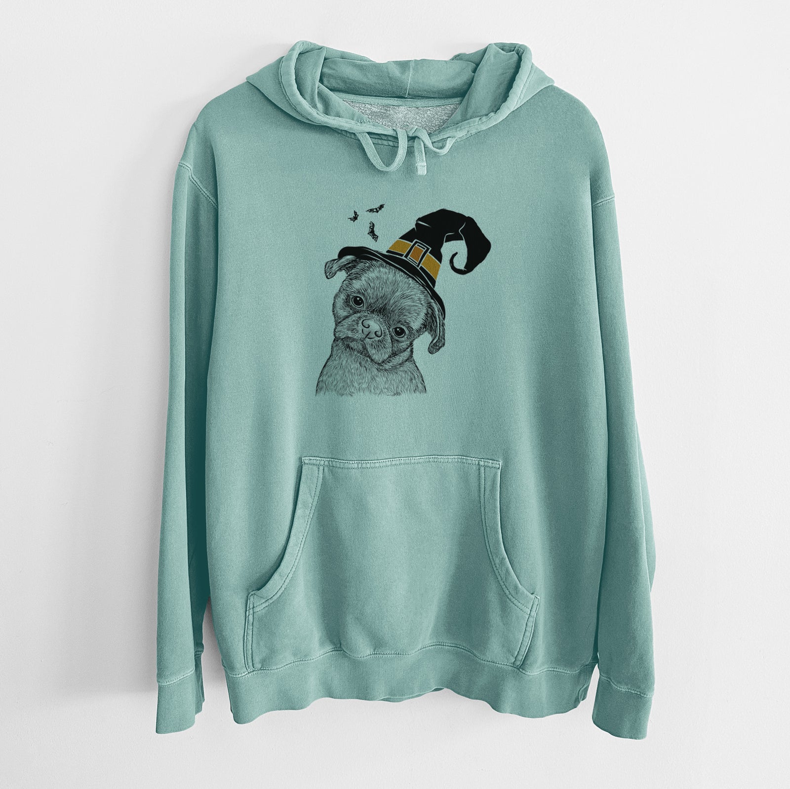 Hand-drawn sketch of Koko the Shih Tzu wearing a witch hat on a Mint Unisex pigment dyed hoodie