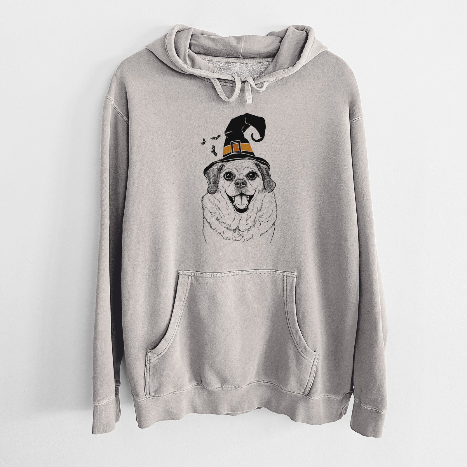 Hand-drawn sketch of Little Man the Puggle wearing a witch hat on a Cement Unisex pigment dyed hoodie