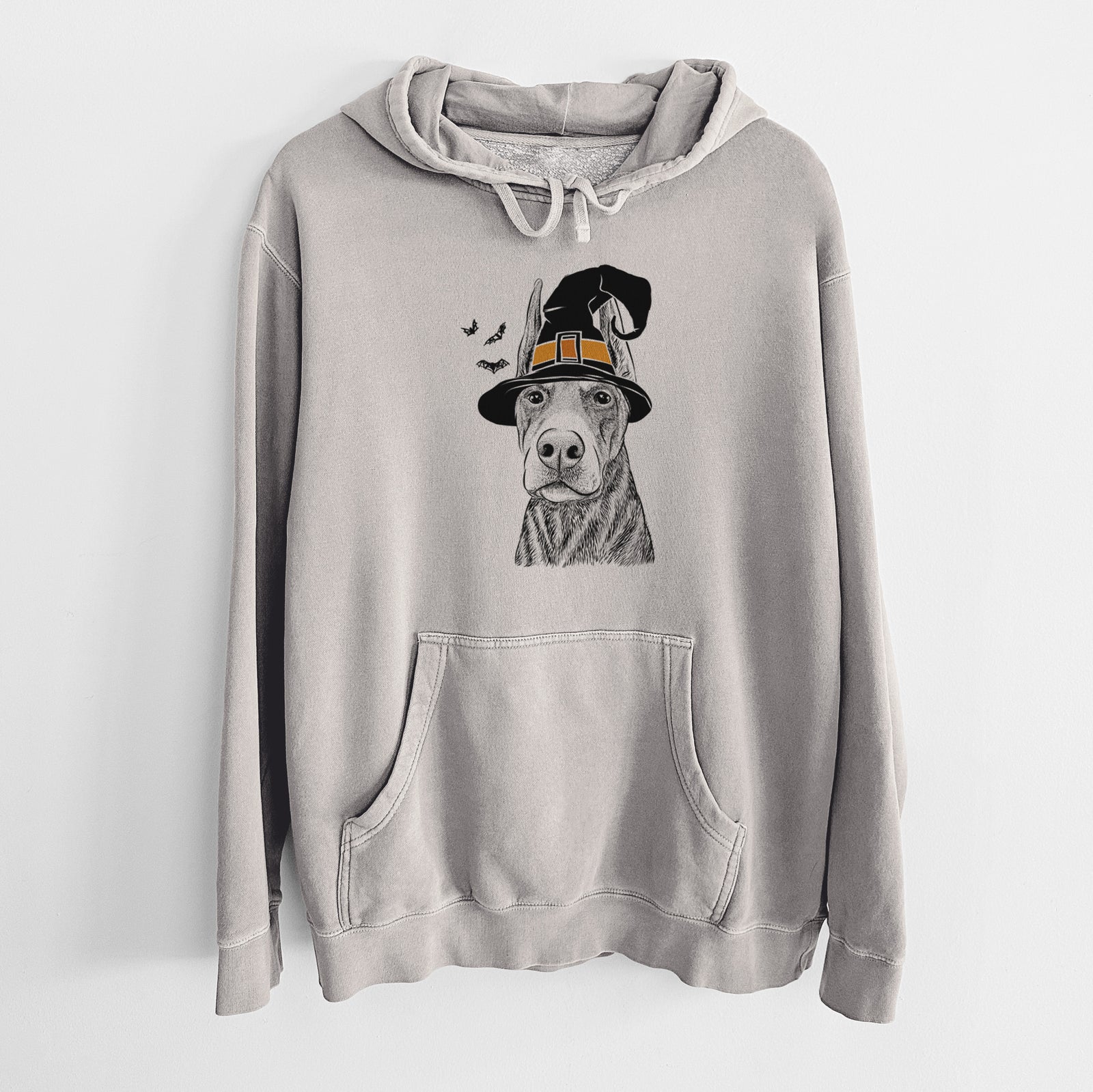 Hand-drawn sketch of Luna the Doberman Pinscher wearing a witch hat on a Cement Unisex pigment dyed hoodie