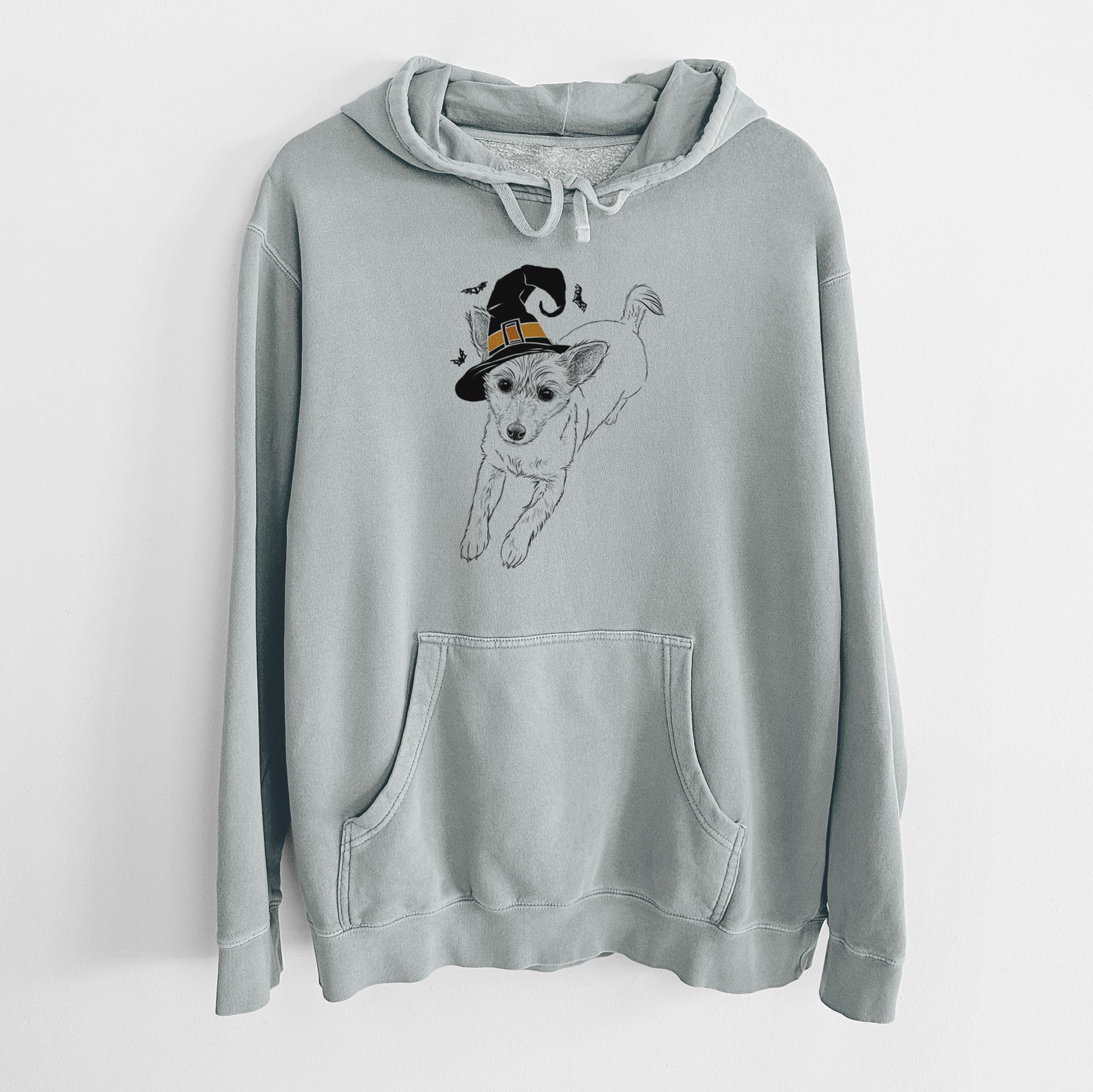 Hand-drawn sketch of Maisie the Terrier Mix wearing a witch hat on a Sage Unisex pigment dyed hoodie
