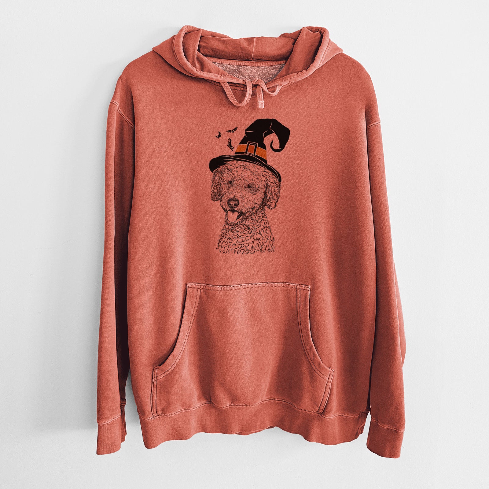Hand-drawn sketch of Marlow the Goldendoodle wearing a witch hat on an Amber Unisex pigment dyed hoodie