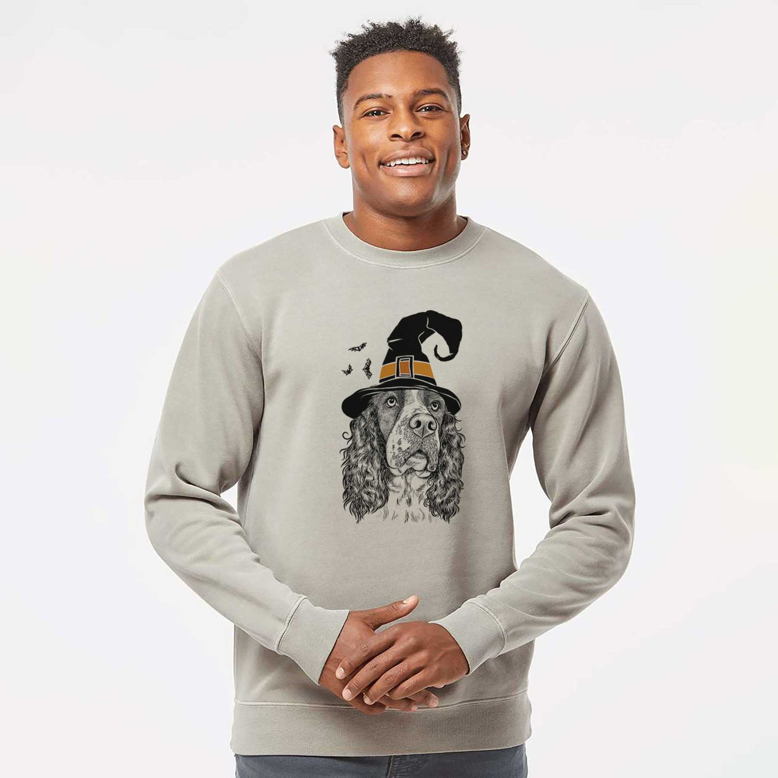 Hand-drawn sketch of Millie Mae the English Springer Spaniel wearing a witch hat on a Cement Unisex pigment dyed crew sweatshirt