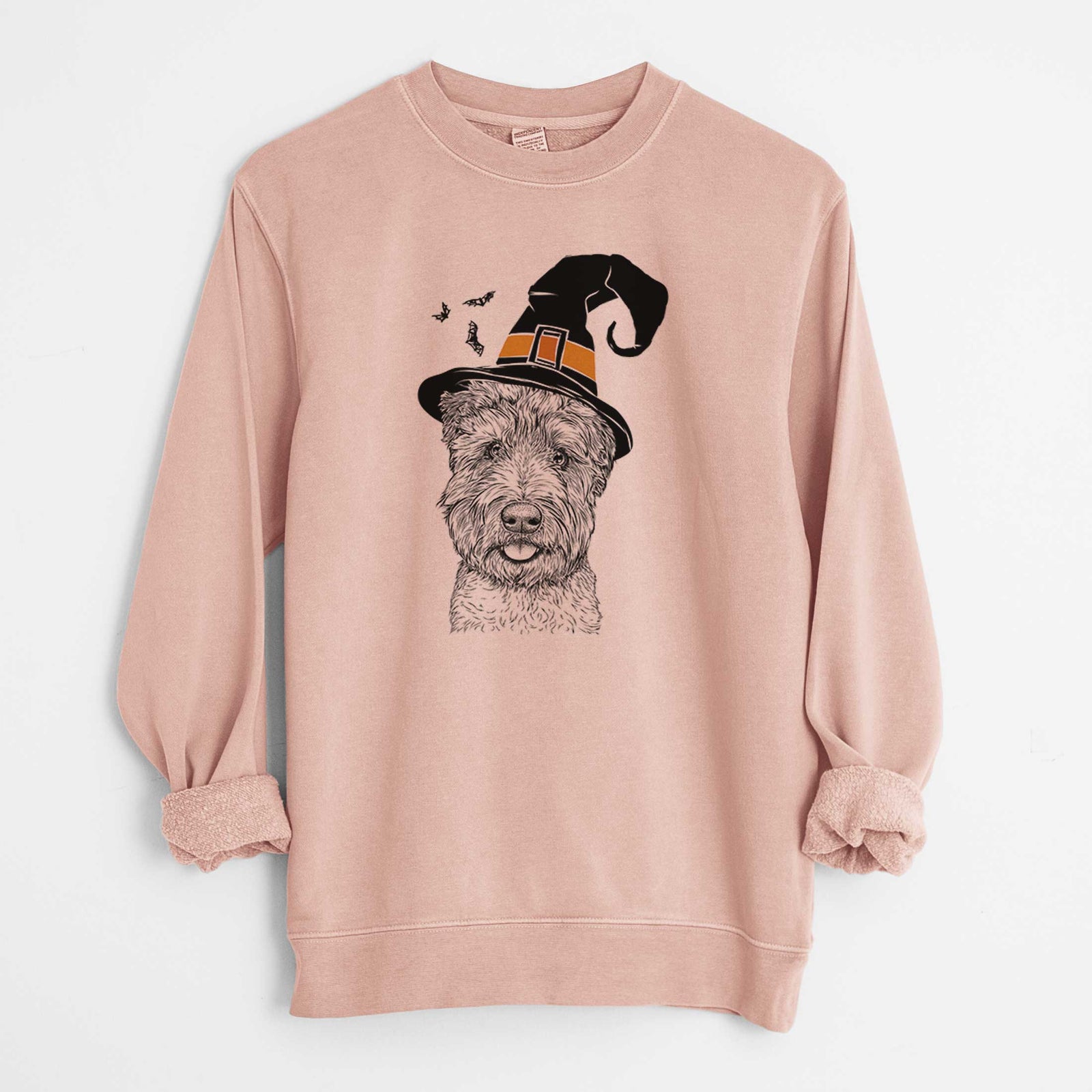 Hand-drawn sketch of Milton the Soft Coated Wheaten Terrier wearing a witch hat on a Dusty Pink Unisex pigment dyed crew sweatshirt