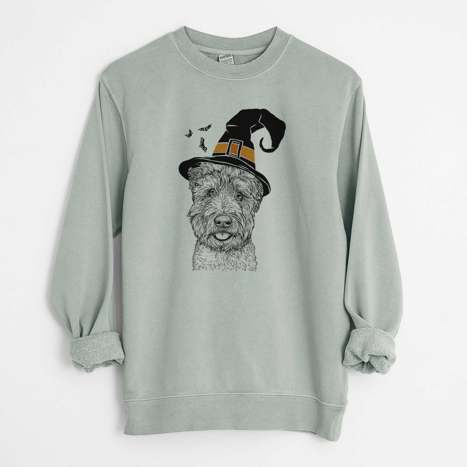Hand-drawn sketch of Milton the Soft Coated Wheaten Terrier wearing a witch hat on a Sage Unisex pigment dyed crew sweatshirt