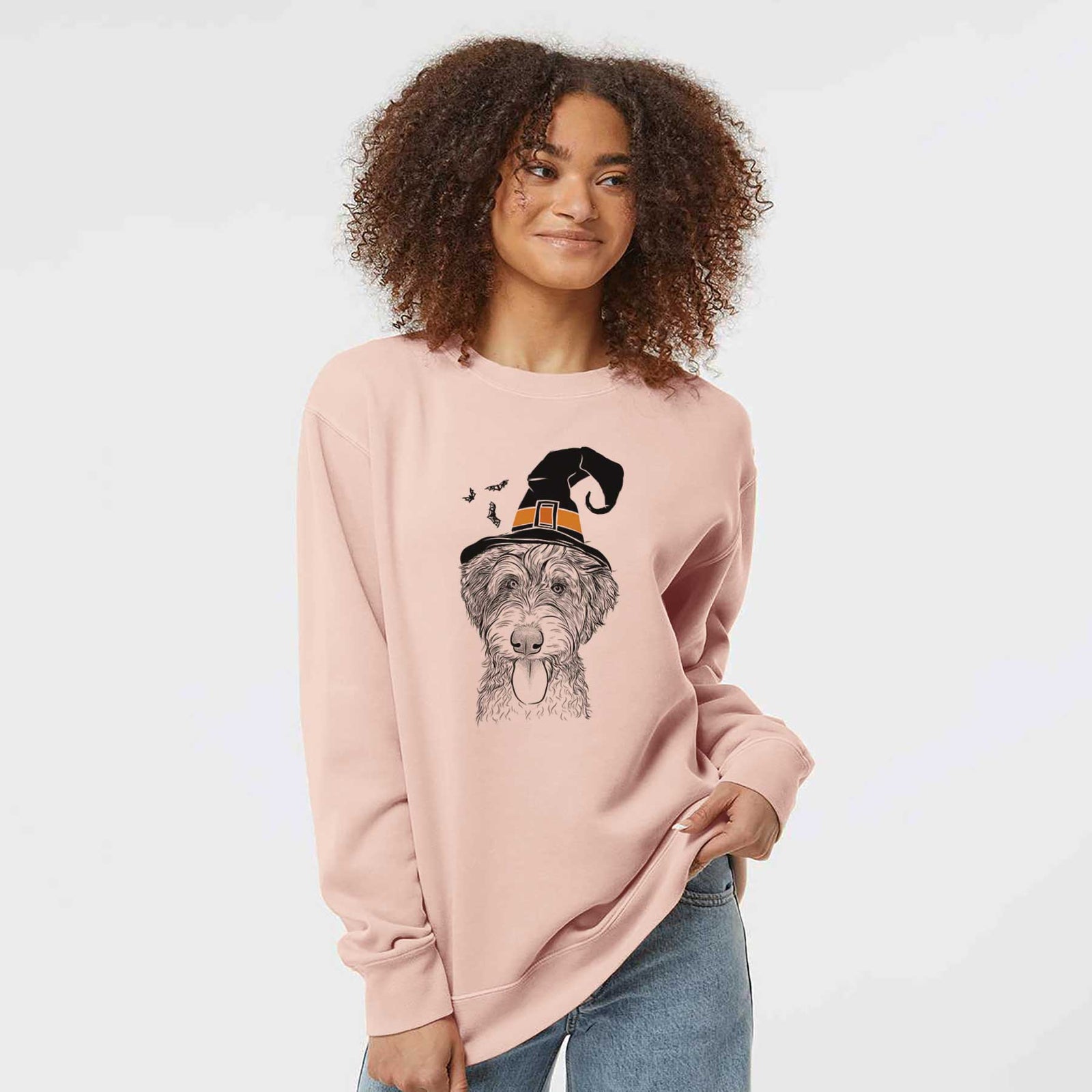 Hand-drawn sketch of Myrtle Mae the Aussiedoodle wearing a witch hat on a Dusty Pink Unisex pigment dyed crew sweatshirt