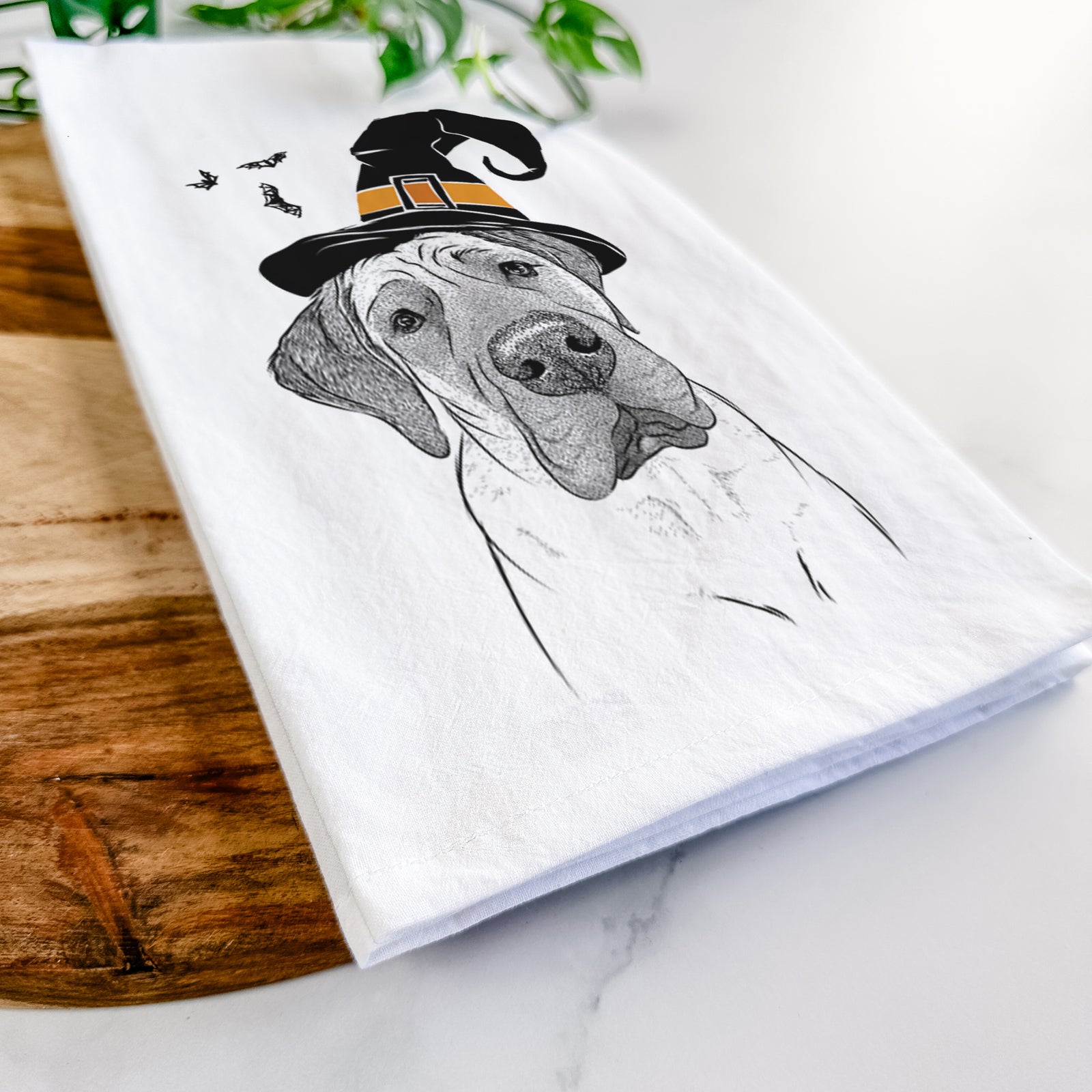 Hand-drawn sketch of Nutterbutter the English Mastiff wearing a witch hat on a tea towel