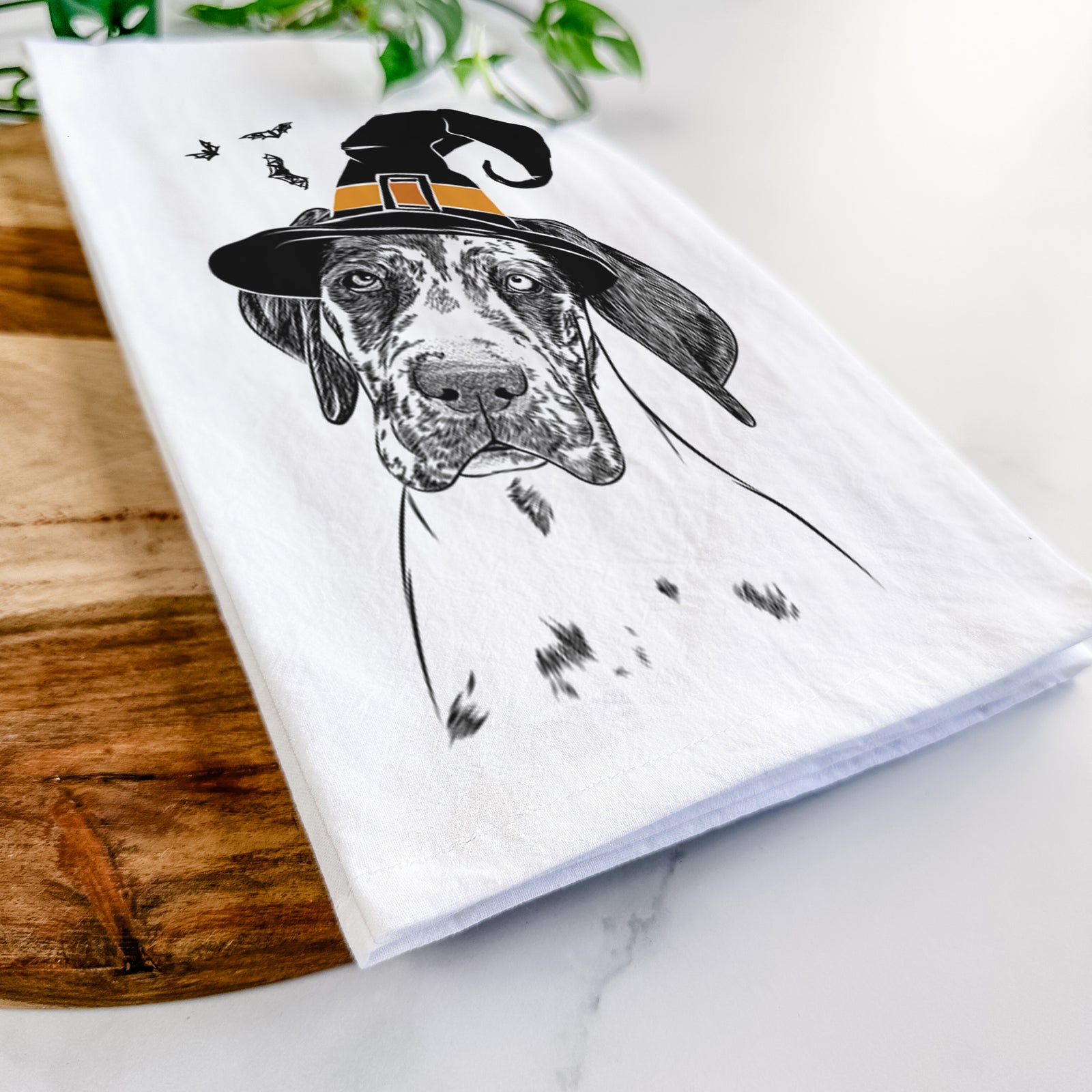 Hand-drawn sketch of Nyx the Great Dane wearing a witch hat on a tea towel