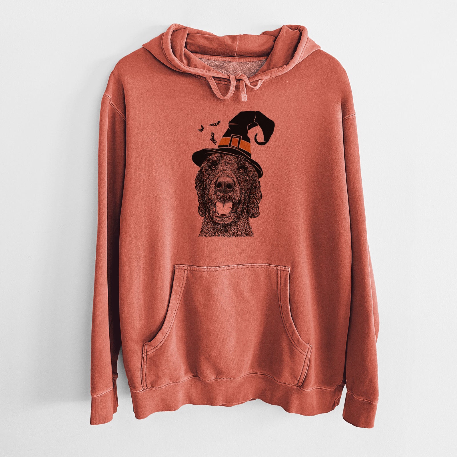 Hand-drawn sketch of Obi James the Goldendoodle wearing a witch hat on an Amber Unisex pigment dyed hoodie