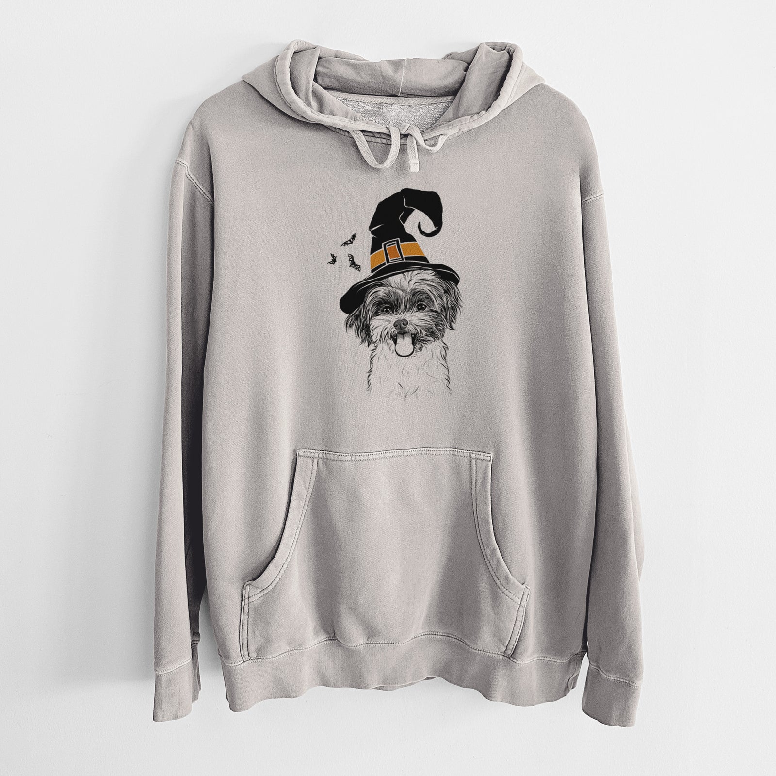 Hand-drawn sketch of Pepper the Shihpoo wearing a witch hat on a Cement Unisex pigment dyed hoodie
