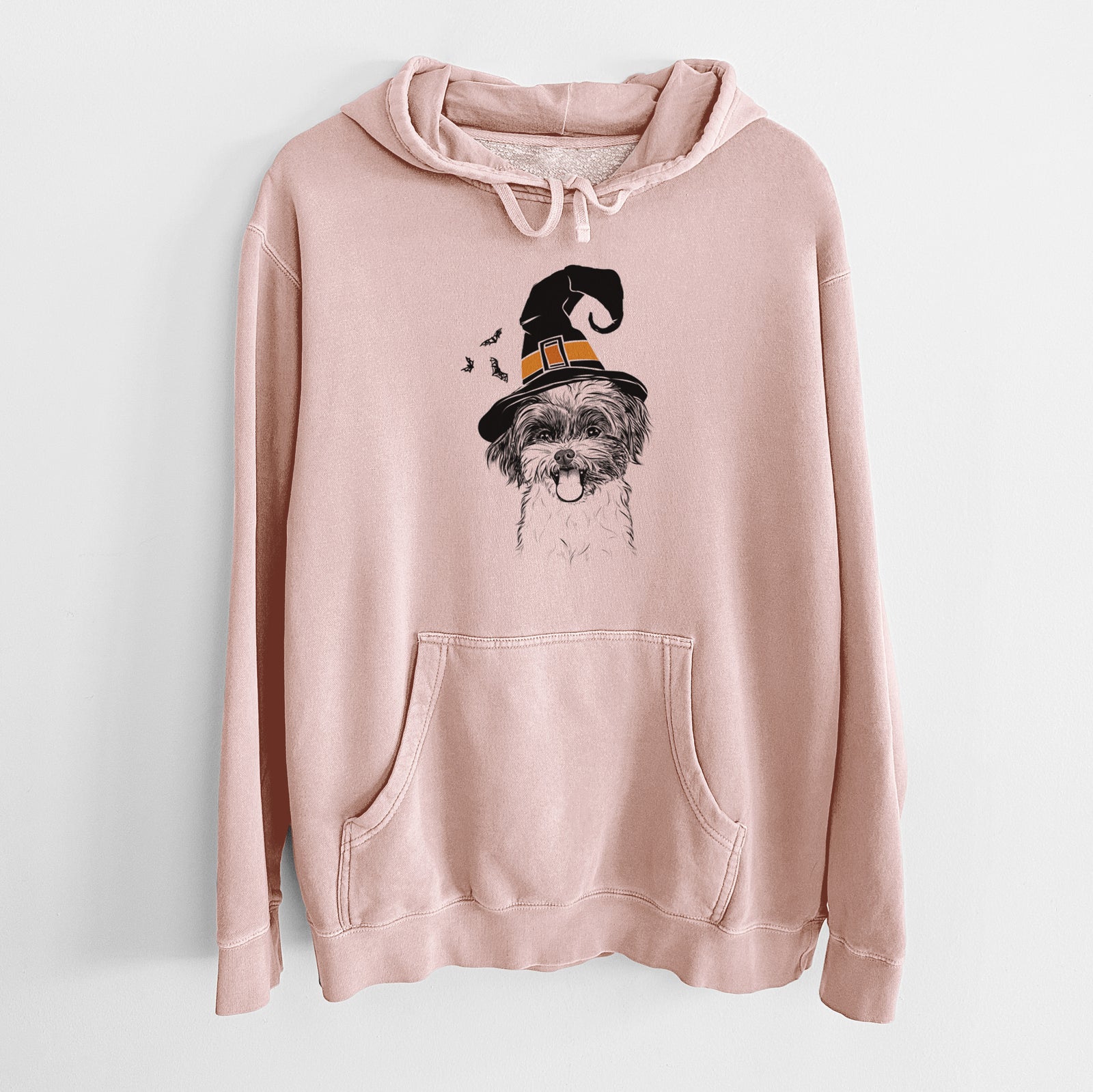 Hand-drawn sketch of Pepper the Shihpoo wearing a witch hat on a Dusty Pink Unisex pigment dyed hoodie