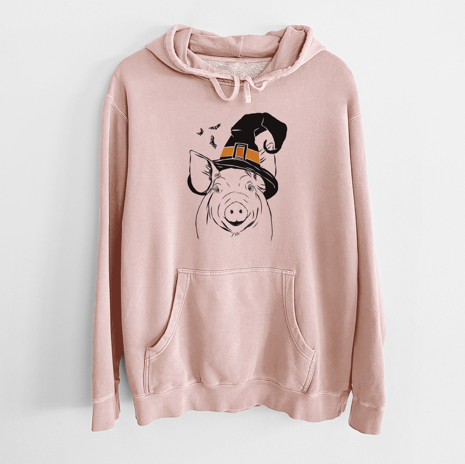 Hand-drawn sketch of Perry the Pig wearing a witch hat on a Dusty Pink Unisex pigment dyed hoodie