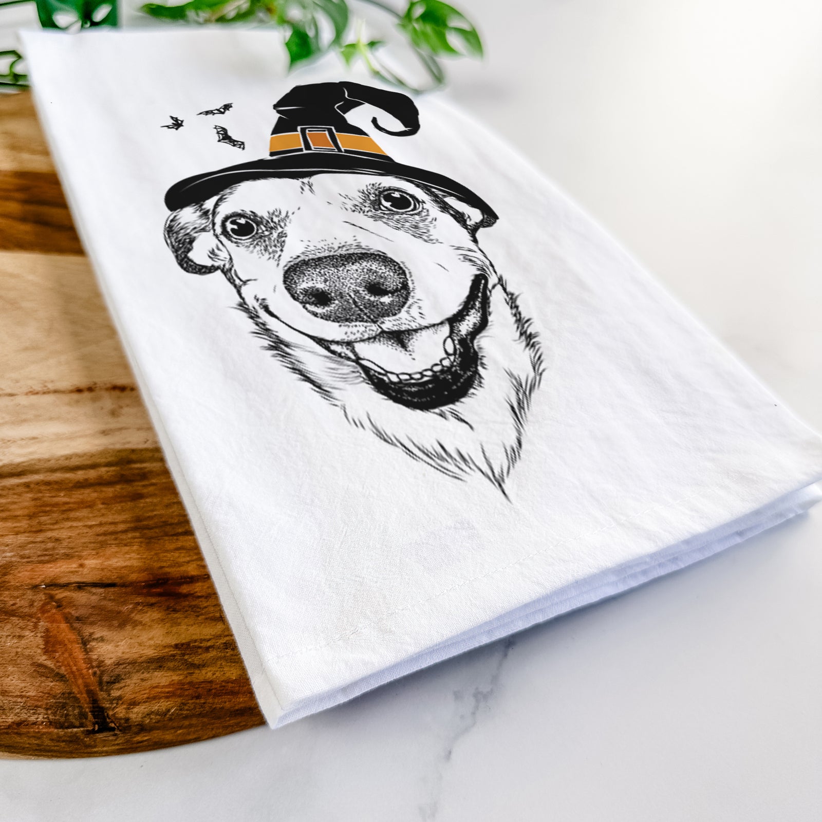 Hand-drawn sketch of Petrah the Staffy Mix wearing a witch hat on a tea towel