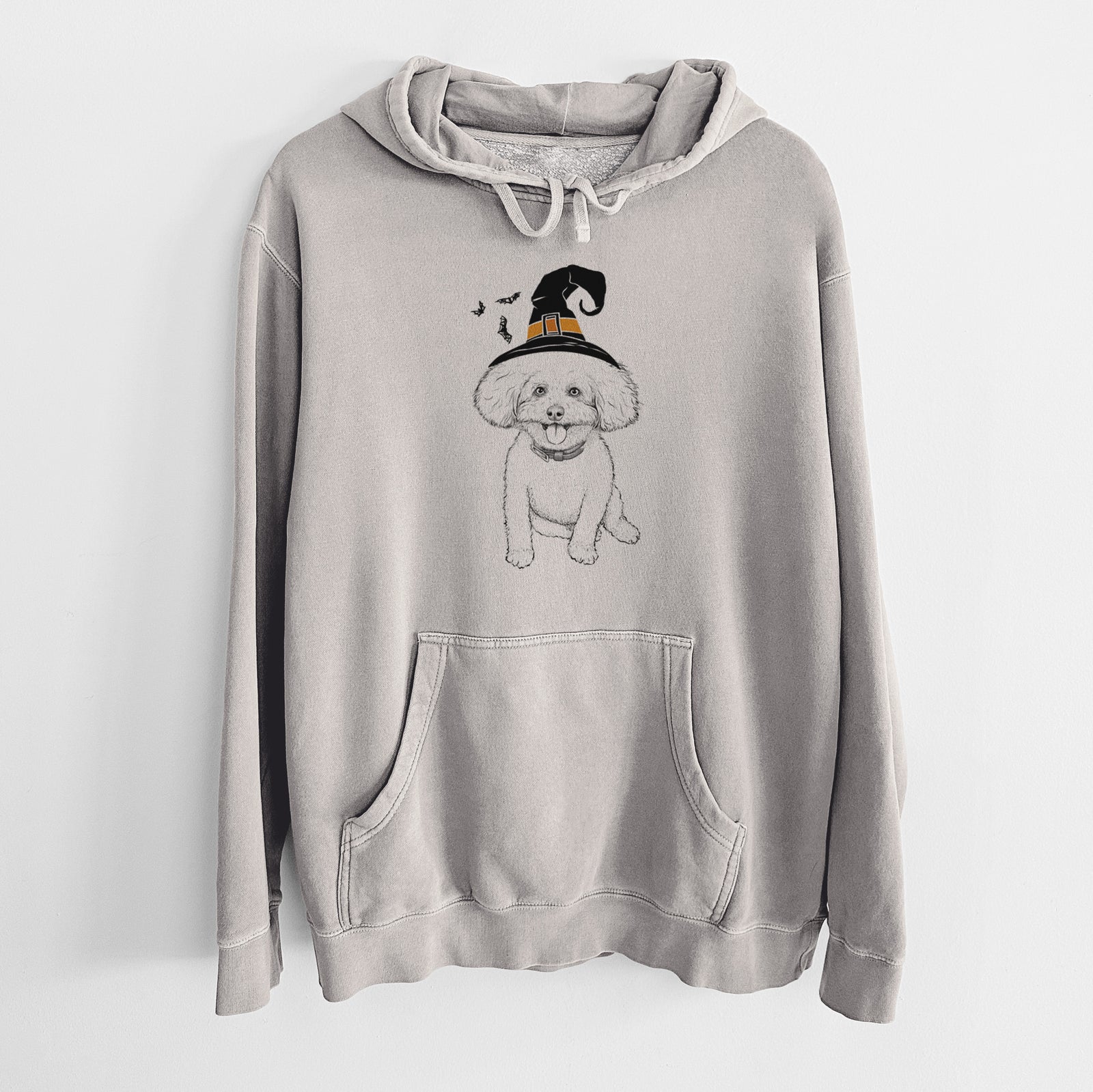Hand-drawn sketch of Peyton the Bichon Frise wearing a witch hat on a Cement Unisex pigment dyed hoodie