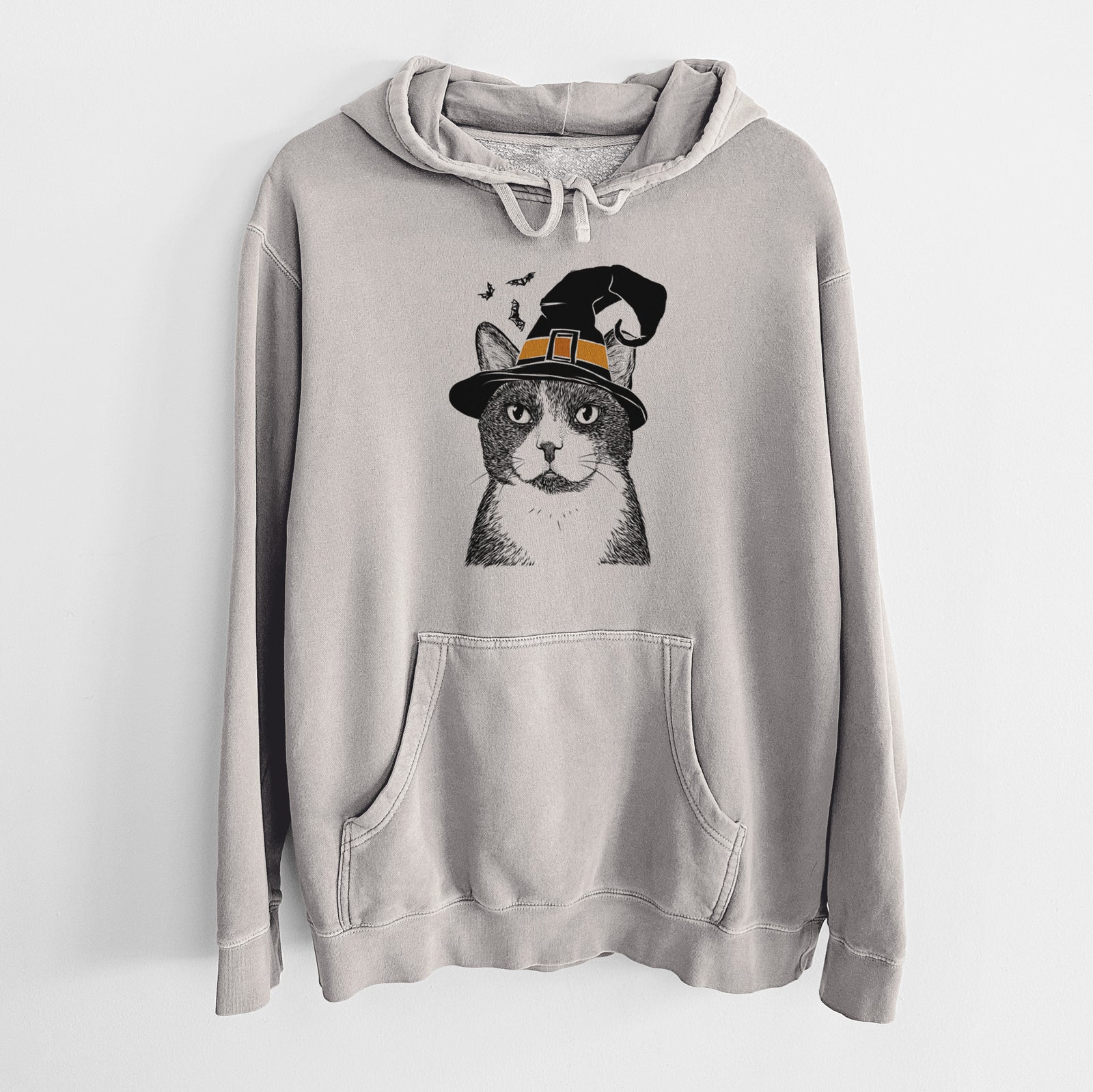 Hand-drawn sketch of Pinky the Tuxedo Cat wearing a witch hat on a Cement Unisex pigment dyed hoodie