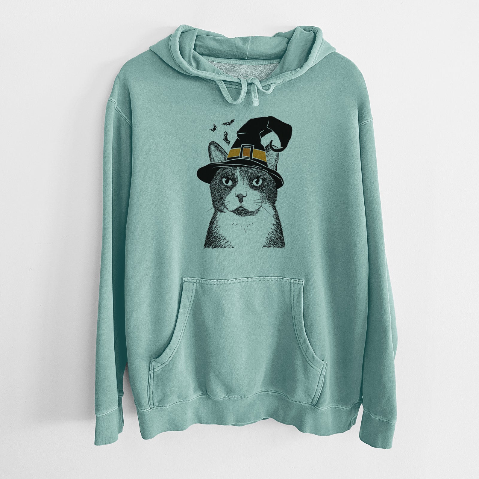 Hand-drawn sketch of Pinky the Tuxedo Cat wearing a witch hat on a Mint Unisex pigment dyed hoodie
