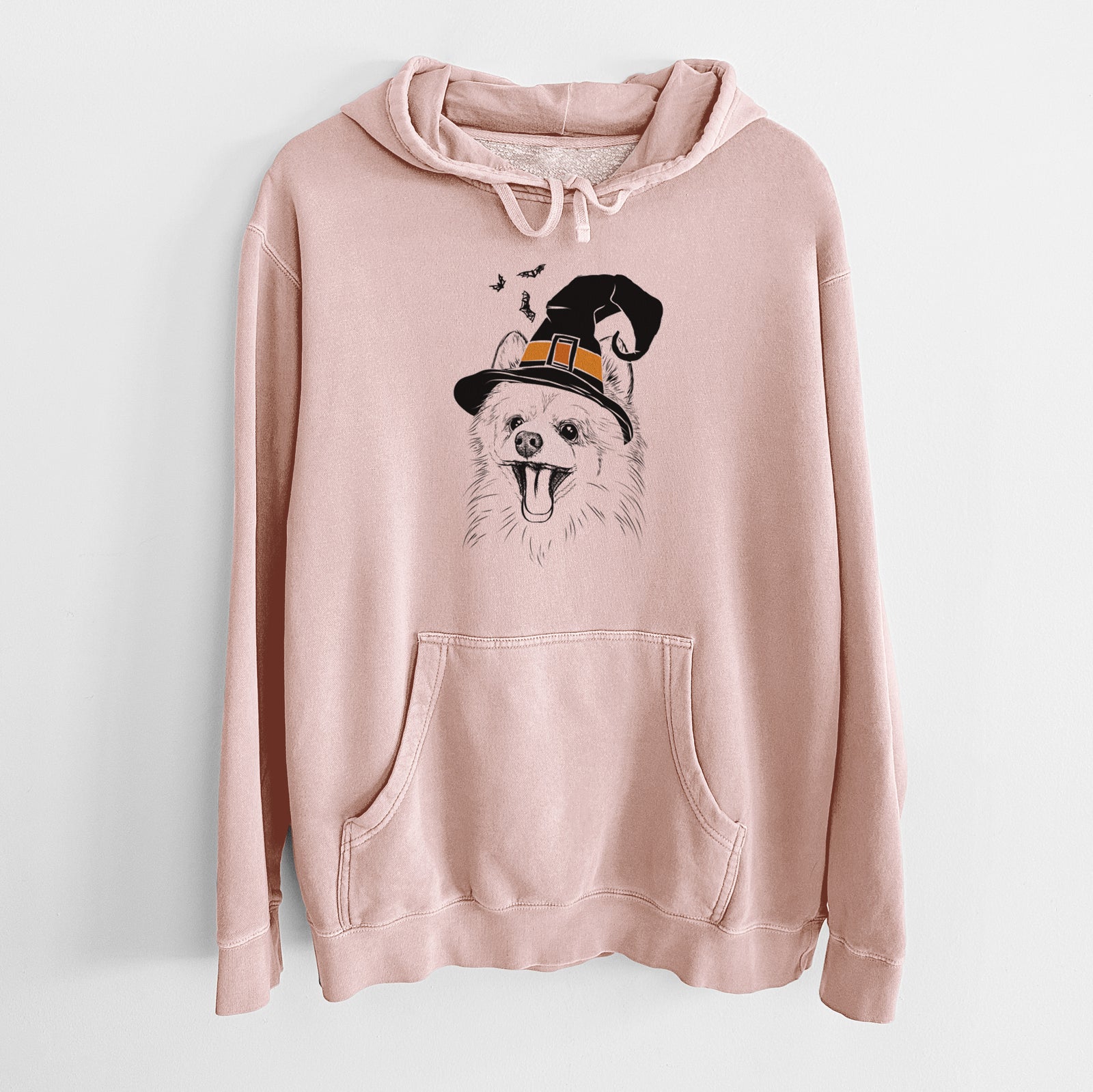 Hand-drawn sketch of Quinn the Pomeranian wearing a witch hat on a Dusty Pink Unisex pigment dyed hoodie