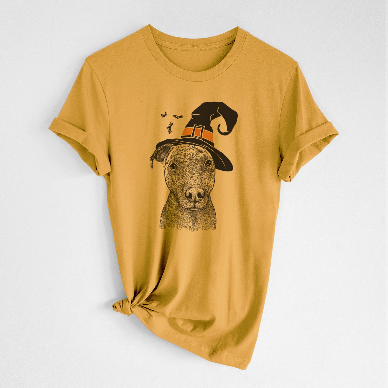 Hand-drawn sketch of Reeses the Pitbull wearing a witch hat on a Mustard Unisex crewneck, worn by a woman
