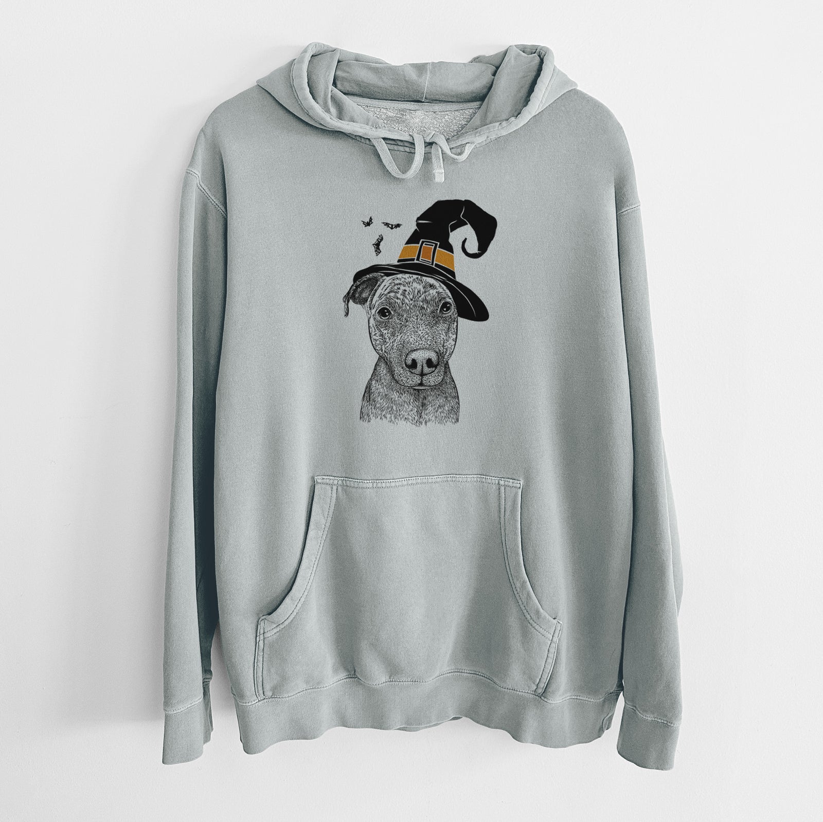 Hand-drawn sketch of Reeses the Pitbull wearing a witch hat on a Sage Unisex pigment dyed hoodie