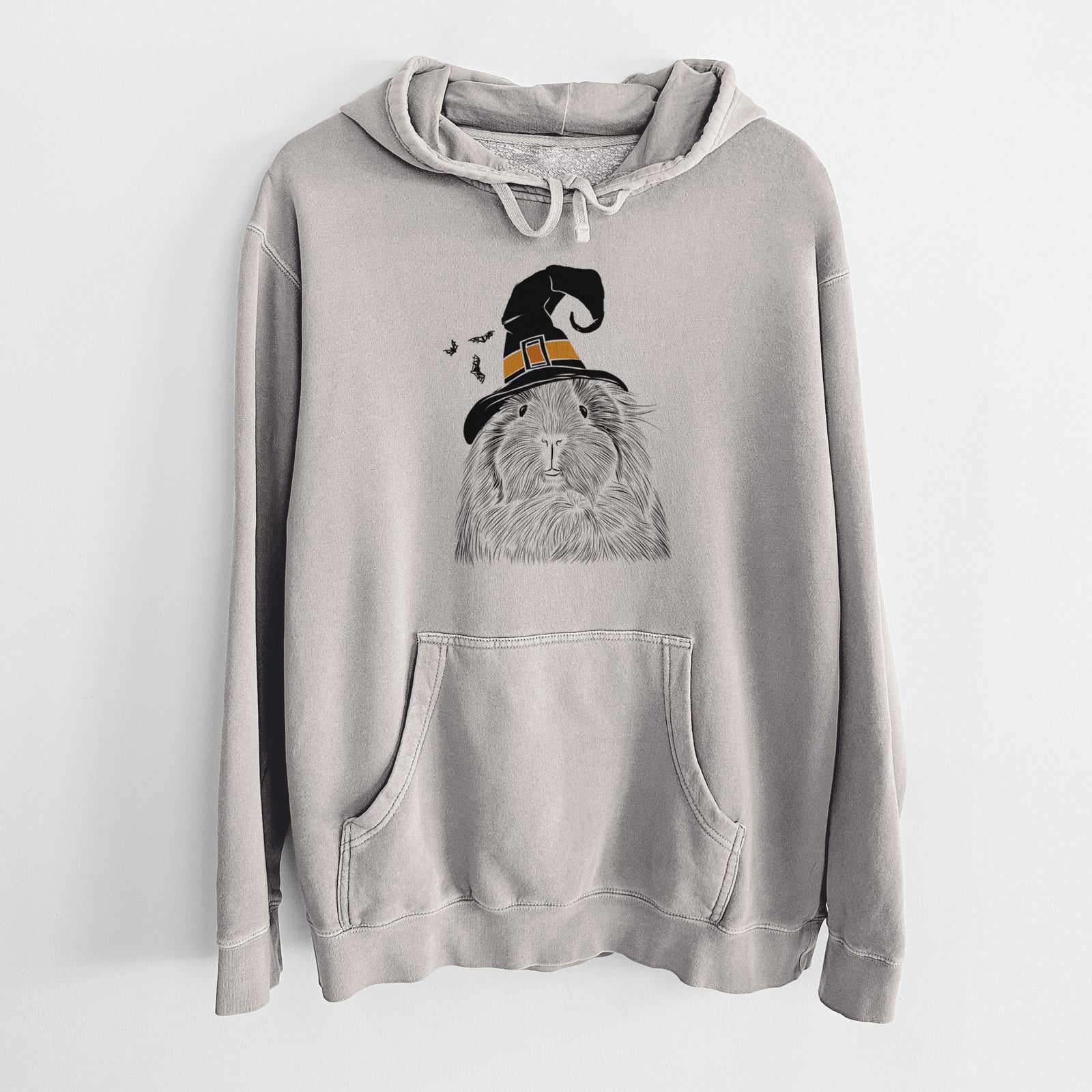 Hand-drawn sketch of Rhino the Guinea Pig wearing a witch hat on a Cement Unisex pigment dyed hoodie