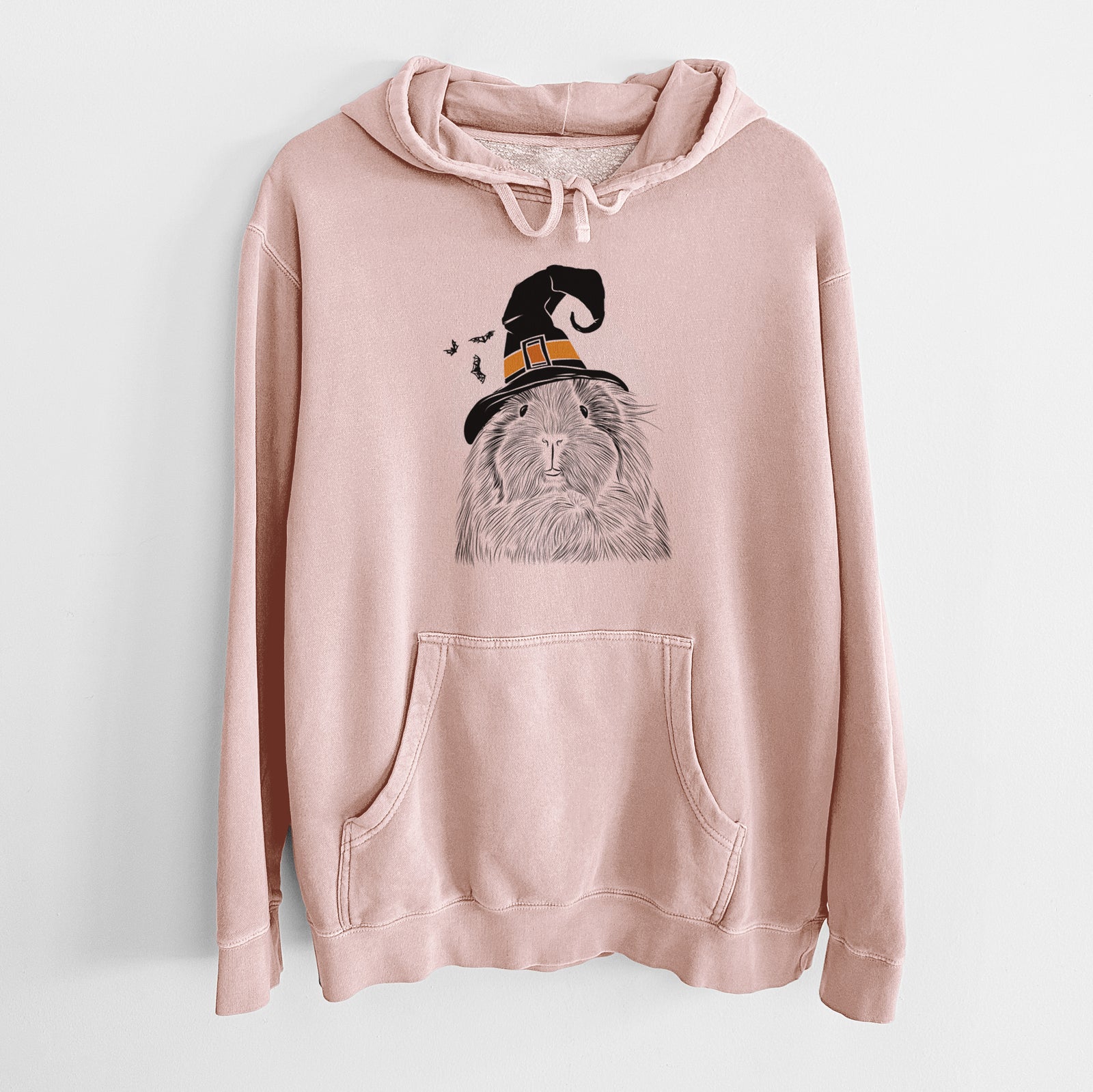 Hand-drawn sketch of Rhino the Guinea Pig wearing a witch hat on a Dusty Pink Unisex pigment dyed hoodie