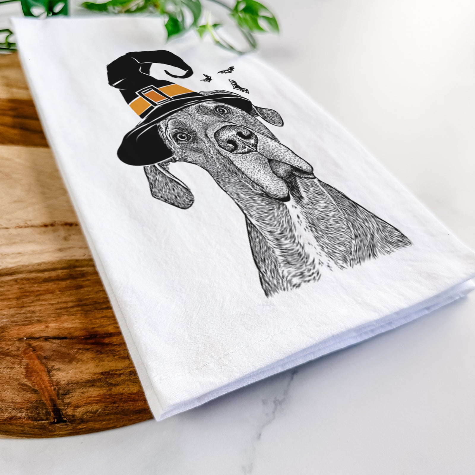 Hand-drawn sketch of River the Great Dane wearing a witch hat on a tea towel