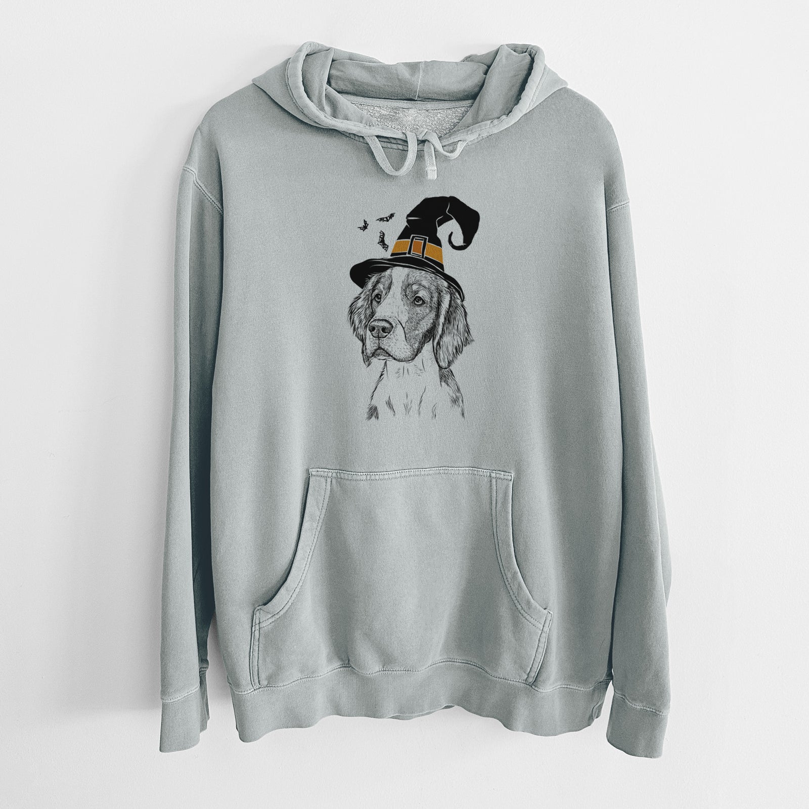 Hand-drawn sketch of Roxy the Welsh Springer Spaniel wearing a witch hat on a Sage Unisex pigment dyed hoodie