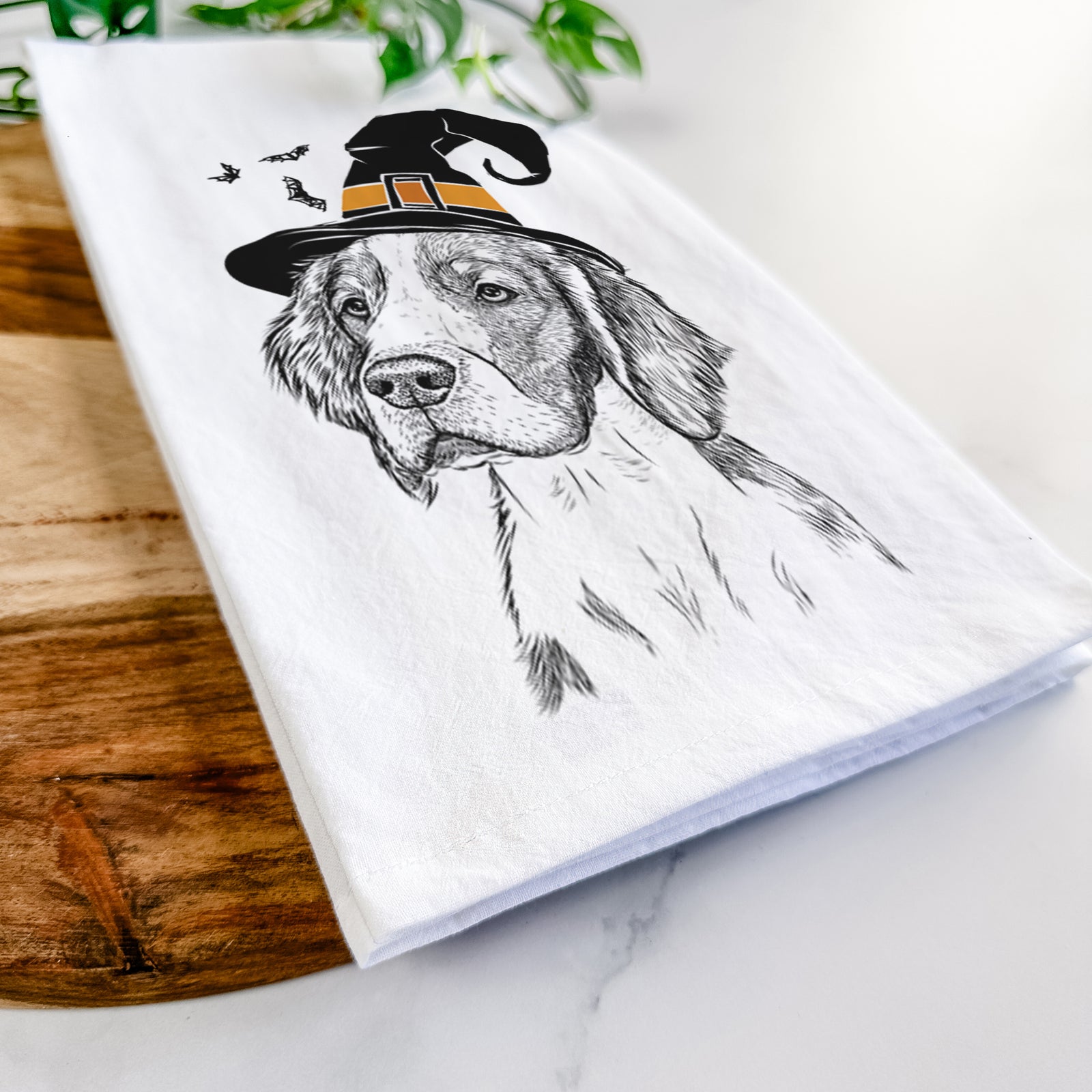 Hand-drawn sketch of Roxy the Welsh Springer Spaniel wearing a witch hat on a tea towel