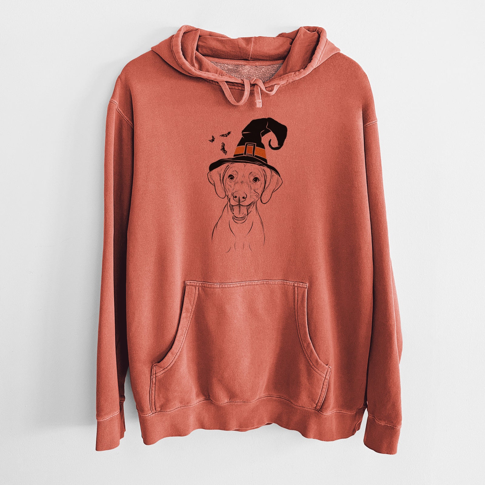 Hand-drawn sketch of Ruby the Vizsla wearing a witch hat on an Amber Unisex pigment dyed hoodie