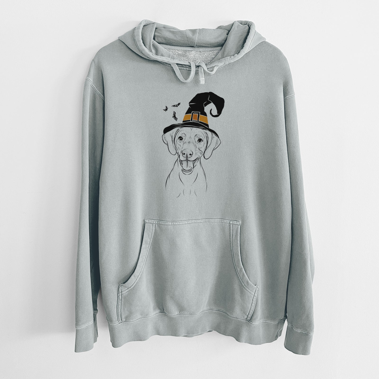Hand-drawn sketch of Ruby the Vizsla wearing a witch hat on a Sage Unisex pigment dyed hoodie
