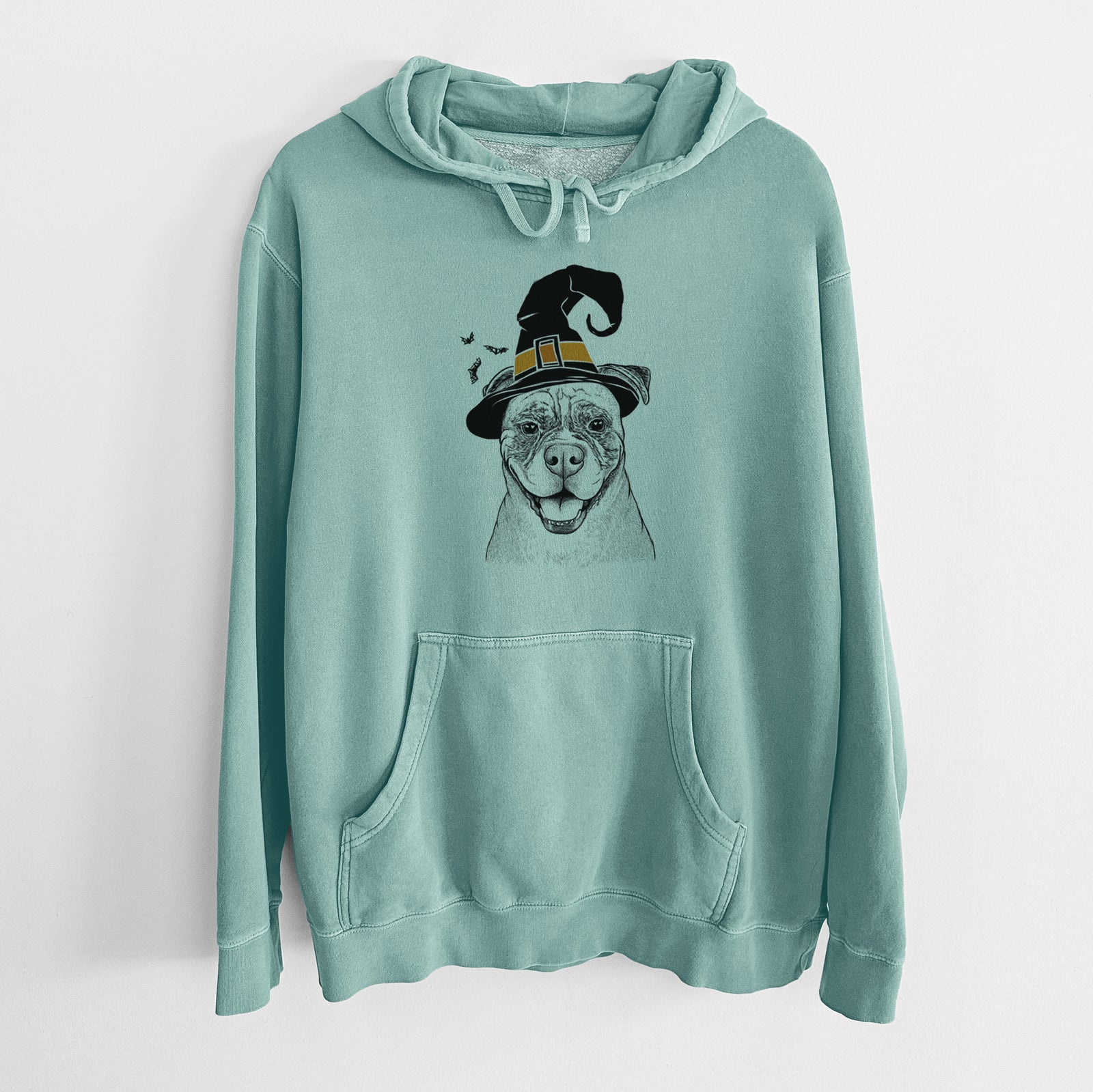 Hand-drawn sketch of Rufus the American Bulldog wearing a witch hat on a Mint Unisex pigment dyed hoodie