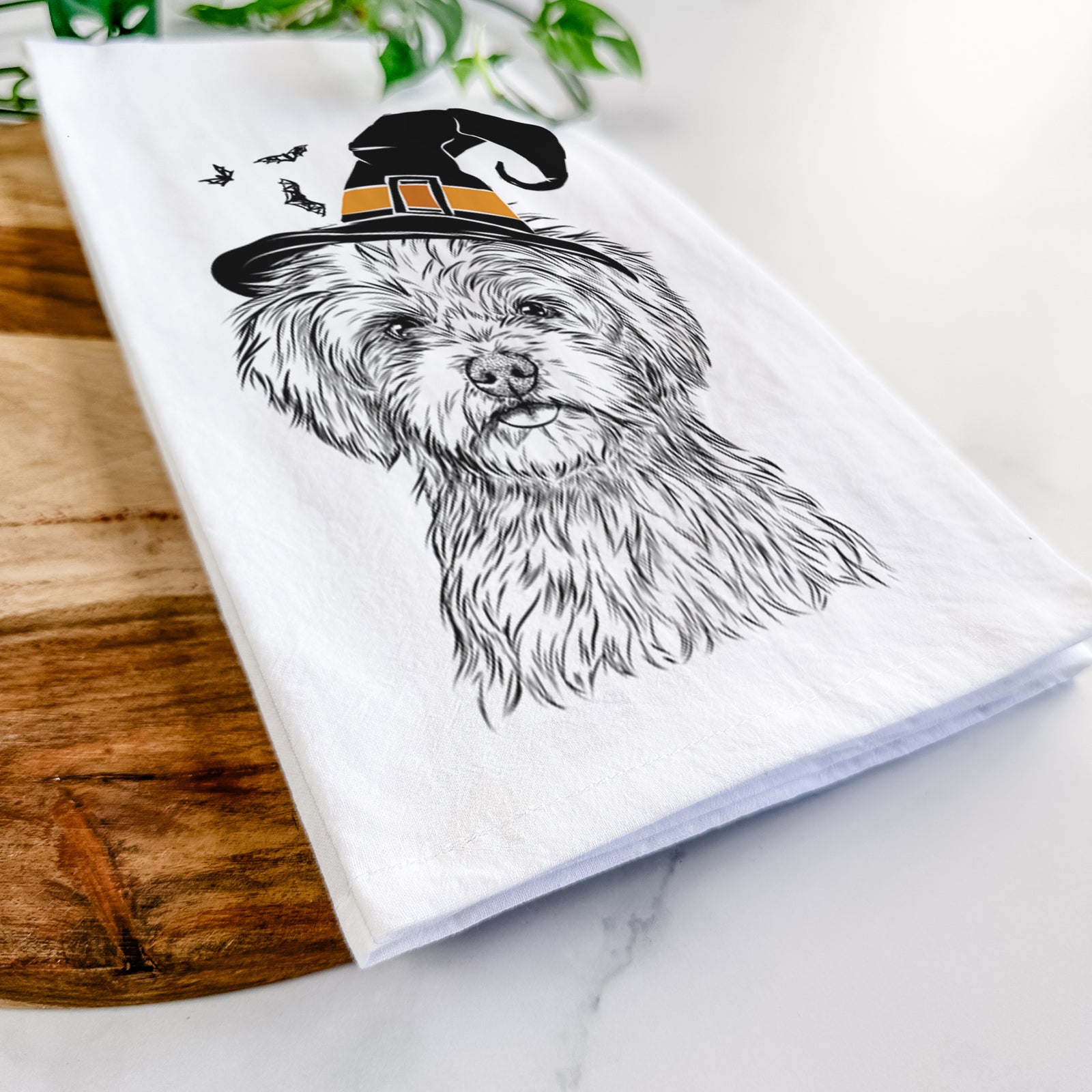 Hand-drawn sketch of Sammy the Shorkie wearing a witch hat on a tea towel